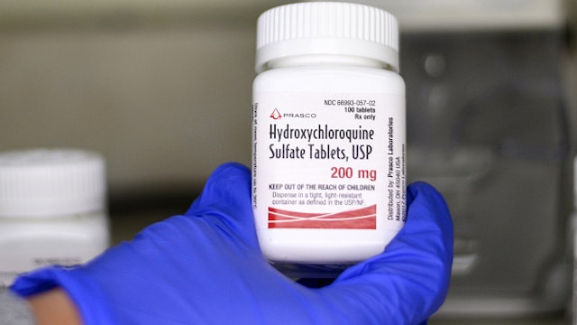 A bottle of Prasco Laboratories Hydroxychloroquine Sulphate is arranged for a photograph in the Queens borough of New York, U.S., on Tuesday, April 7, 2020. India partially lifted a ban on the exports of malaria drug hydroxychloroquine and paracetamol after President Donald Trump sought supplies for the U.S., according to government officials with knowledge of the matter.