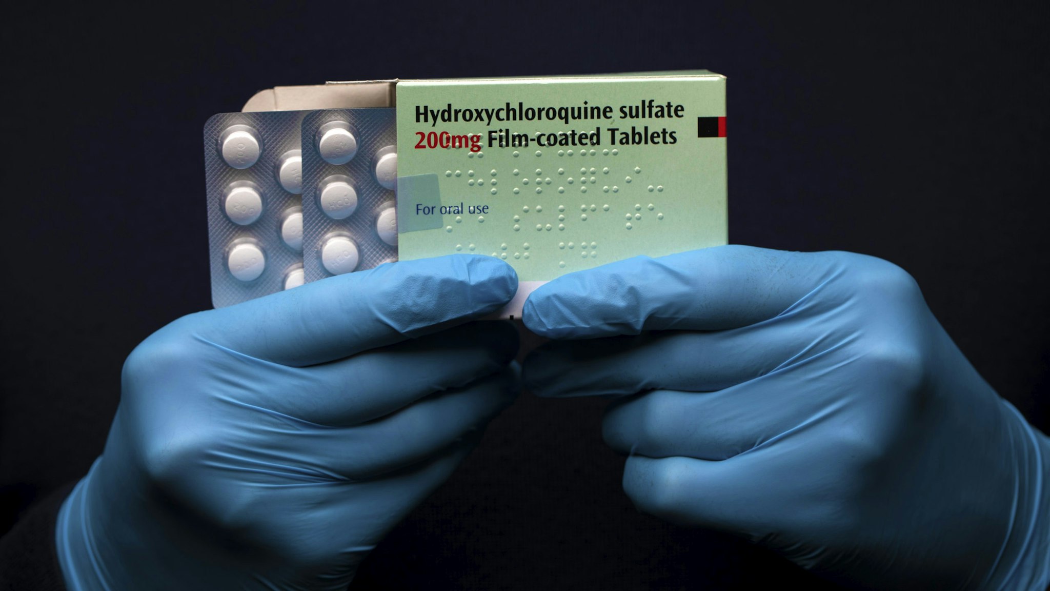 LONDON, UNITED KINGDOM - MARCH 26: In this photo illustration a pack of Hydroxychloroquine Sulfate medication is held up on March 26, 2020 in London, United Kingdom. The Coronavirus (COVID-19) pandemic has spread to many countries across the world, claiming over 20,000 lives and infecting hundreds of thousands more. U.S. President Donald Trump recently promoted Hydroxychloroquine, a common anti-malaria drug, as a potential treatment for COVID-19 when combined with the antibiotic azithromycin. “HYDROXYCHLOROQUINE &amp; AZITHROMYCIN, taken together, have a real chance to be one of the biggest game changers in the history of medicine,” President Trump tweeted last week.