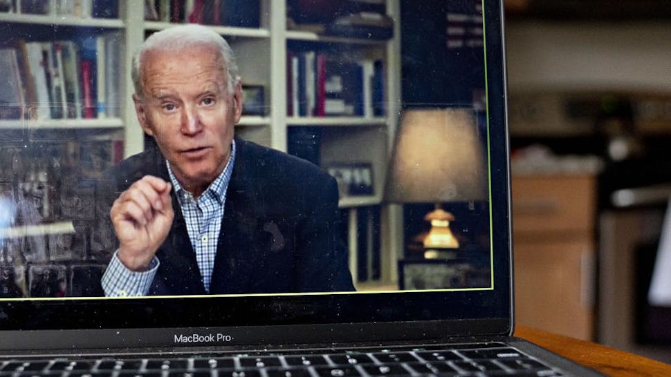 Joe Biden Former Vice President Joe Biden, 2020 Democratic presidential candidate, speaks during a virtual press briefing on a laptop computer in this arranged photograph in Arlington, Virginia, U.S., on Wednesday, March 25, 2020. During the livestreamed news conference today, Biden said he didn't see the need for another debate, which the Democratic National Committee had previously said would happen sometime in April. Photographer: Andrew Harrer/Bloomberg