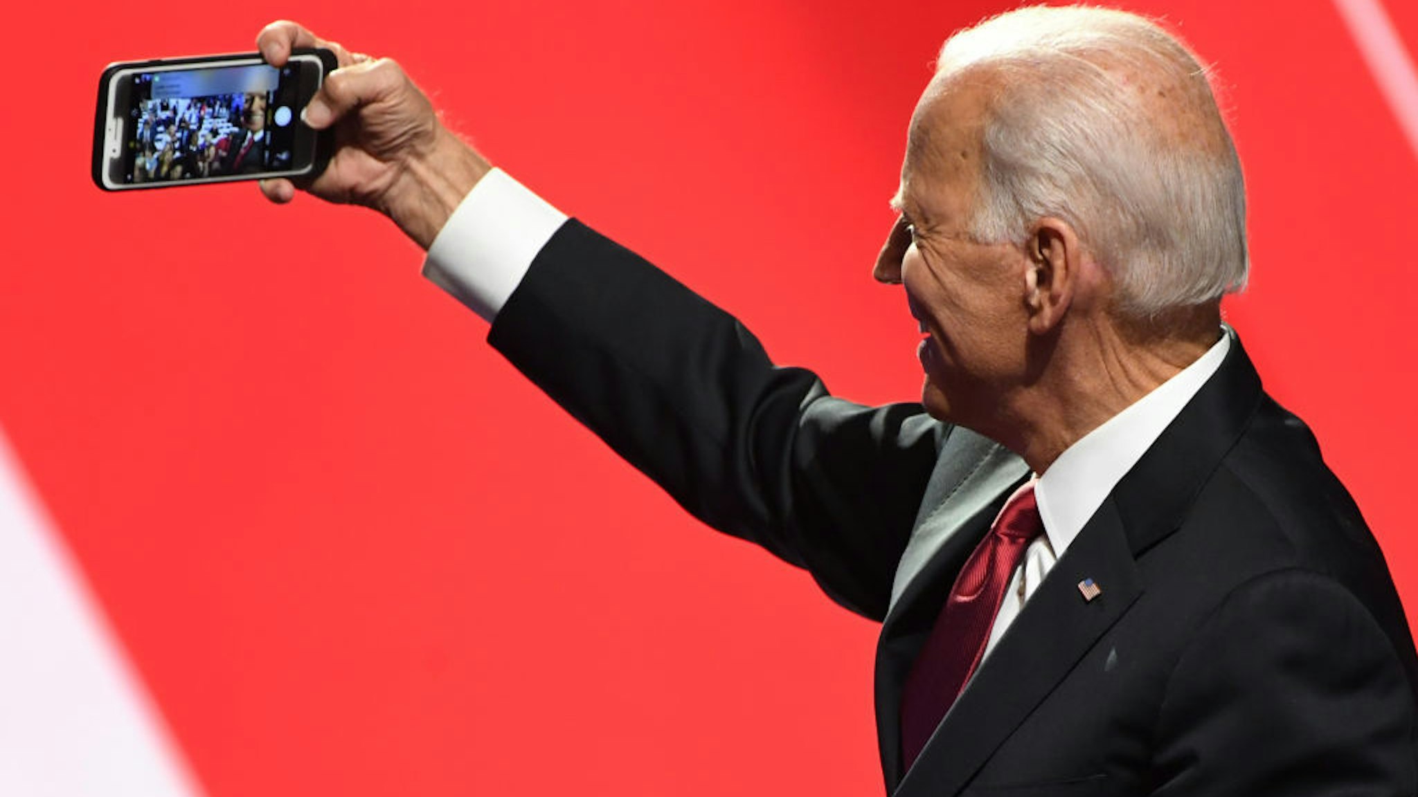 Democratic presidential hopeful former US Vice President Joe Biden takes a selfie with supporters after the fourth Democratic primary debate of the 2020 presidential campaign season co-hosted by The New York Times and CNN at Otterbein University in Westerville, Ohio on October 15, 2019. (Photo by SAUL LOEB / AFP) (Photo by SAUL LOEB/AFP via Getty Images)
