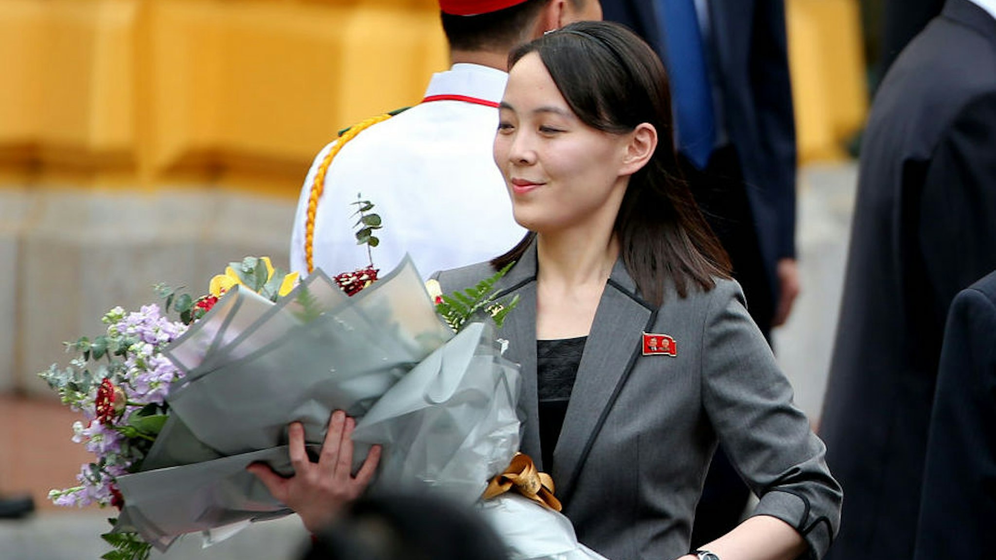 Kim Yo Jong, sister of North Korean leader Kim Jong Un, holds a flower bouquet during a welcoming ceremony at the Presidential Palace in Hanoi, Vietnam, on Friday, March 1, 2019. Kim will have a long train ride home through China to think about what went wrong in his second summit with Donald Trump and how to keep it from reversing his gains of the past year. Photographer: Luong Thai Linh/Pool via Bloomberg
