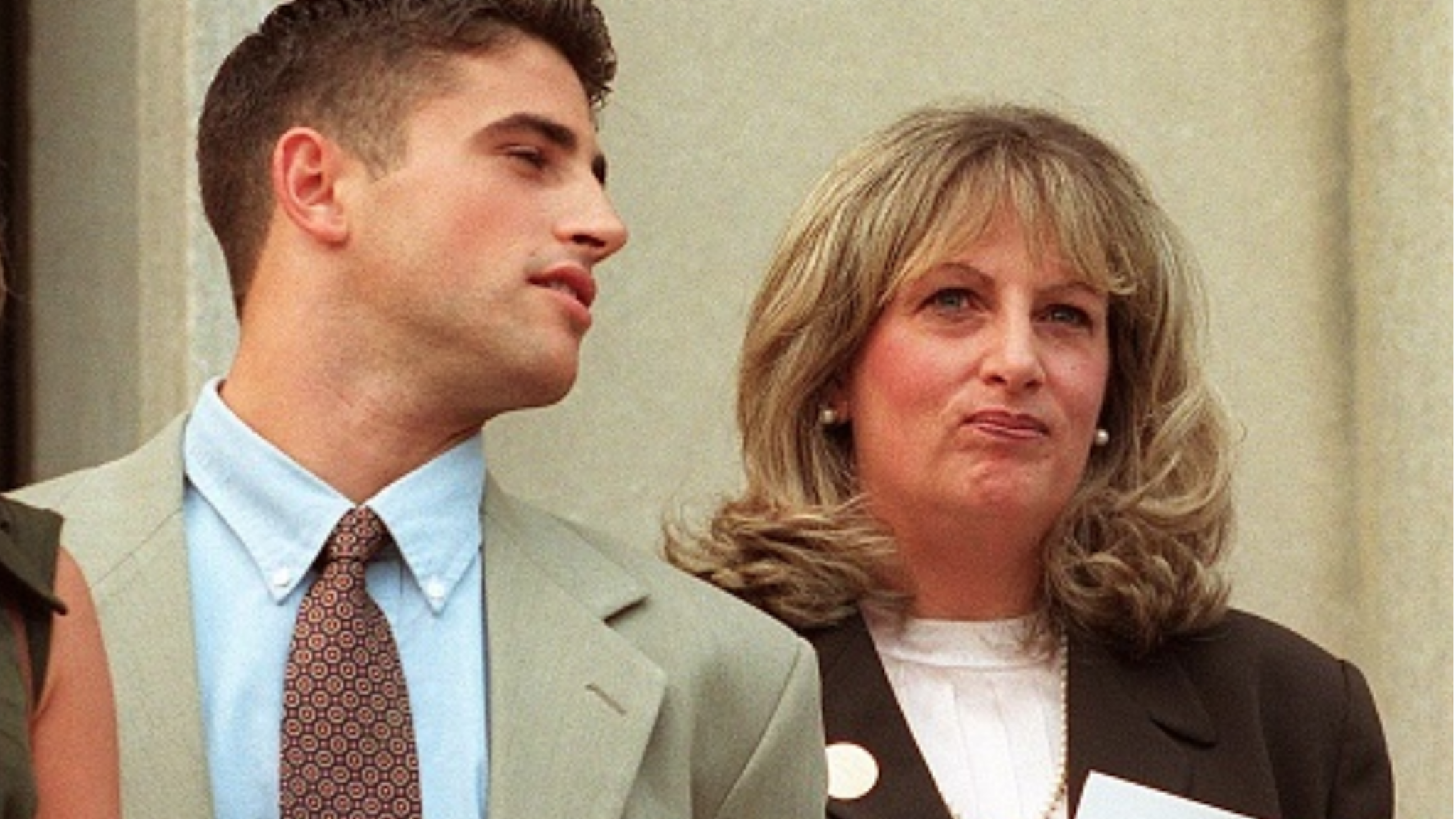 WASHINGTON, DC - JULY 29: Linda Tripp (R) waits to make a statement to reporters beside her daughter Allison (L) and son Ryan (C) in front of the Federal Courthouse 29 July in Washington, DC, after her eighth and final day of testimony before a federal grand jury. Tripp's taped conversations with former White House intern Monica Lewinsky triggered the sex-and-lies probe dogging US President Bill Clinton.