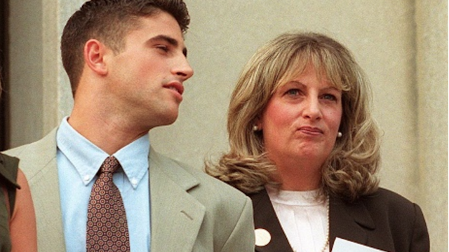 WASHINGTON, DC - JULY 29: Linda Tripp (R) waits to make a statement to reporters beside her daughter Allison (L) and son Ryan (C) in front of the Federal Courthouse 29 July in Washington, DC, after her eighth and final day of testimony before a federal grand jury. Tripp's taped conversations with former White House intern Monica Lewinsky triggered the sex-and-lies probe dogging US President Bill Clinton.