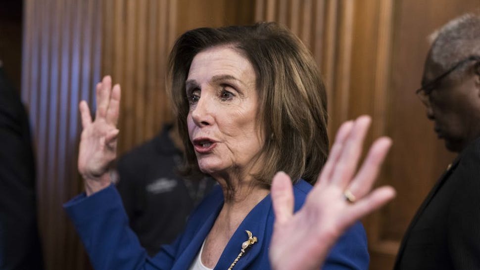 U.S. House Speaker Nancy Pelosi, a Democrat from California, speaks to members to the media after participating in a signing ceremony of H.R. 748, Coronavirus Aid, Relief, and Economic Security (CARES) Act, alongside congressional leadership in the Rayburn Room of the U.S. Capitol in Washington, D.C., U.S., on Friday, March 27, 2020. The House approved the largest stimulus package in U.S. history Friday as part of the response to the economic crisis caused by the coronavirus pandemic, sending the measure to President Donald Trumpfor his signature. Photographer: Sarah Silbiger/Bloomberg