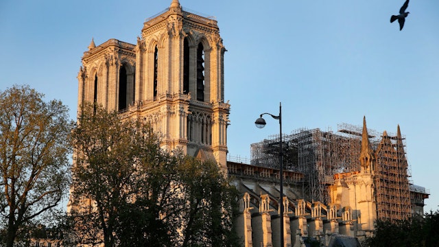 Notre-Dame cathedral is seen at sunset after repair work stops due to the coronavirus (COVID 19) outbreak one year after fire ravaged the emblematic monument as the coronavirus lockdown continues on April 14, 2020 in Paris, France. April 15 marks the first anniversary of the fire at Notre Dame destroying many parts of the Gothic cathedral. The Coronavirus (COVID-19) pandemic has spread to many countries across the world, claiming over 125,000 lives and infecting over 1.9 million people. (Photo by Chesnot/Getty Images)