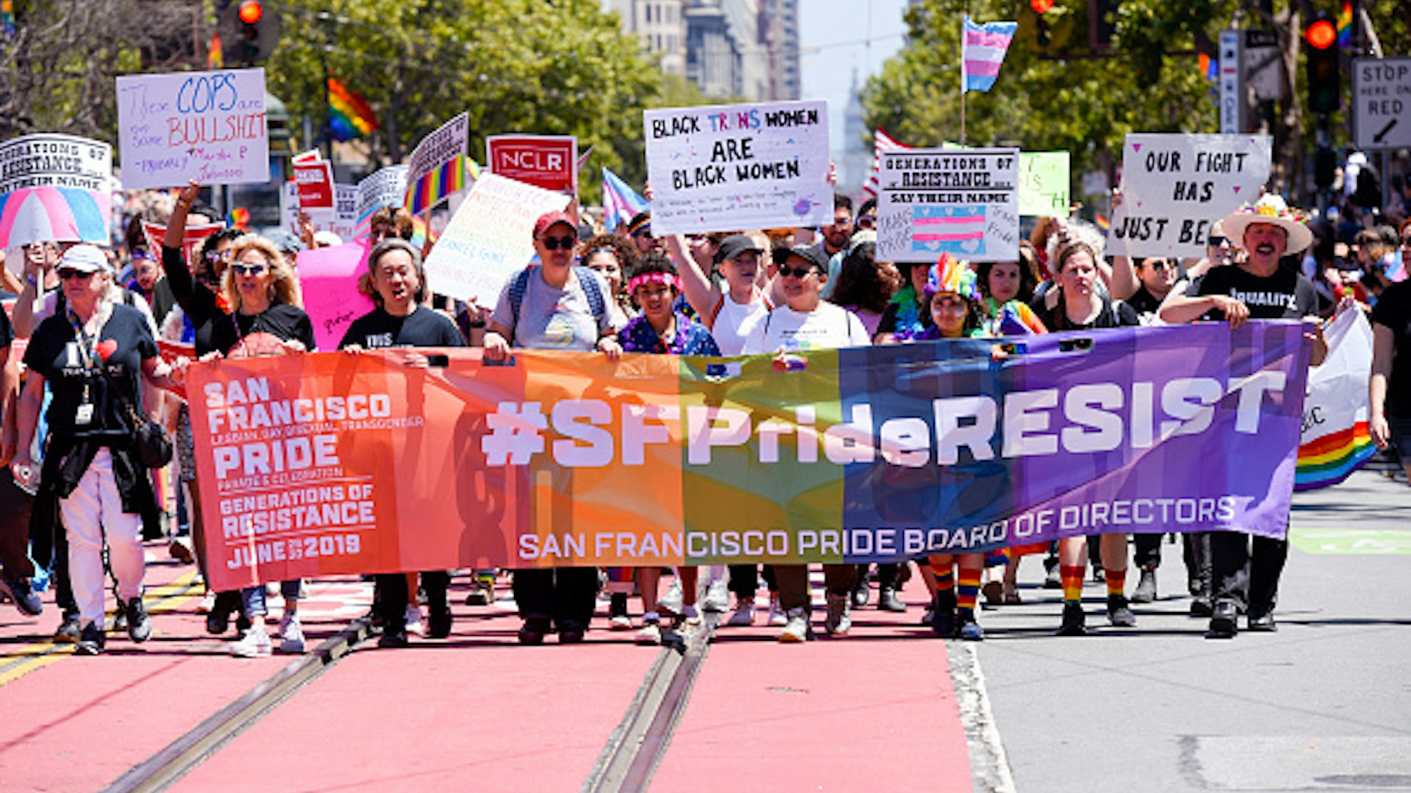 SAN FRANCISCO, CALIFORNIA - JUNE 30: Parade participants walk for a cause during the San Francisco Gay Pride parade on June 30, 2019 in San Francisco, California