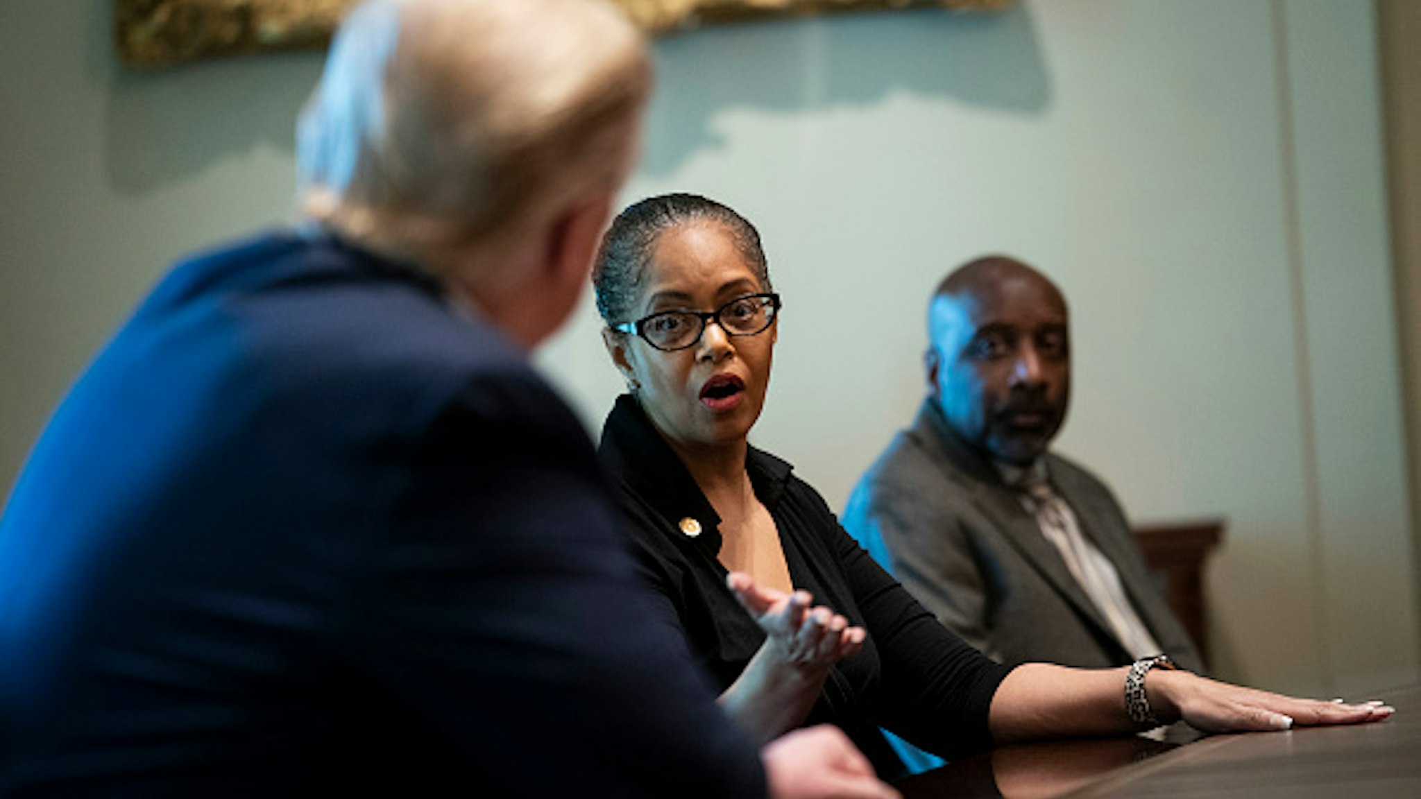 WASHINGTON, DC - APRIL 14: State Rep. Karen Whitsett of Michigan, talks about her bout with the coronavirus as President Donald Trump hosted a meeting with recovered COVID-19 patients in the Cabinet Room at the White House April 14, 2020 in Washington, D.C. During the April 13 Coronavirus Task Force briefing, Trump said the president had "total authority" to reopen the U.S. economy.