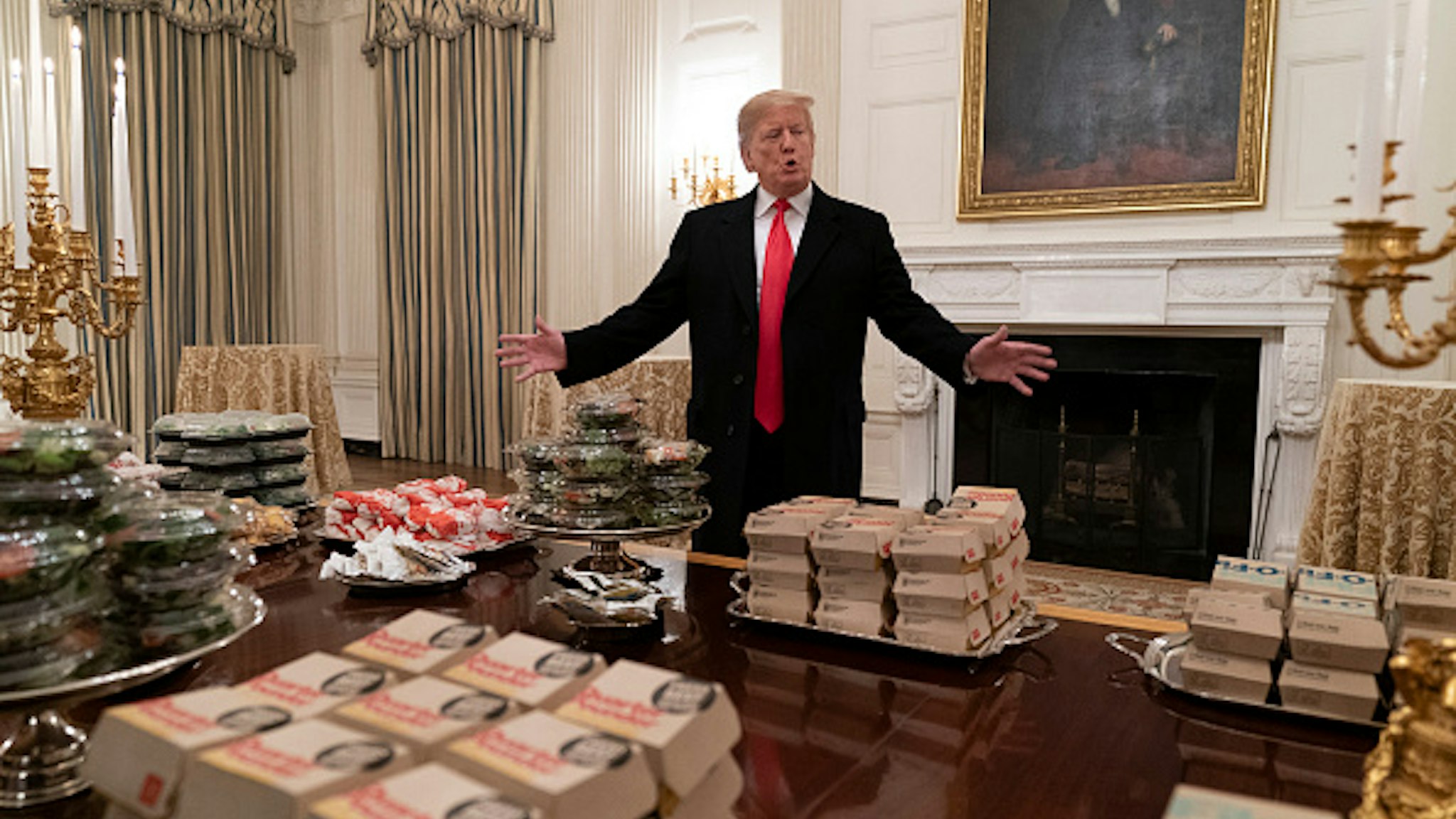WASHINGTON, DC - JANUARY 14: (AFP OUT) U.S President Donald Trump presents fast food to be served to the Clemson Tigers football team to celebrate their Championship at the White House on January 14, 2019 in Washington, DC.