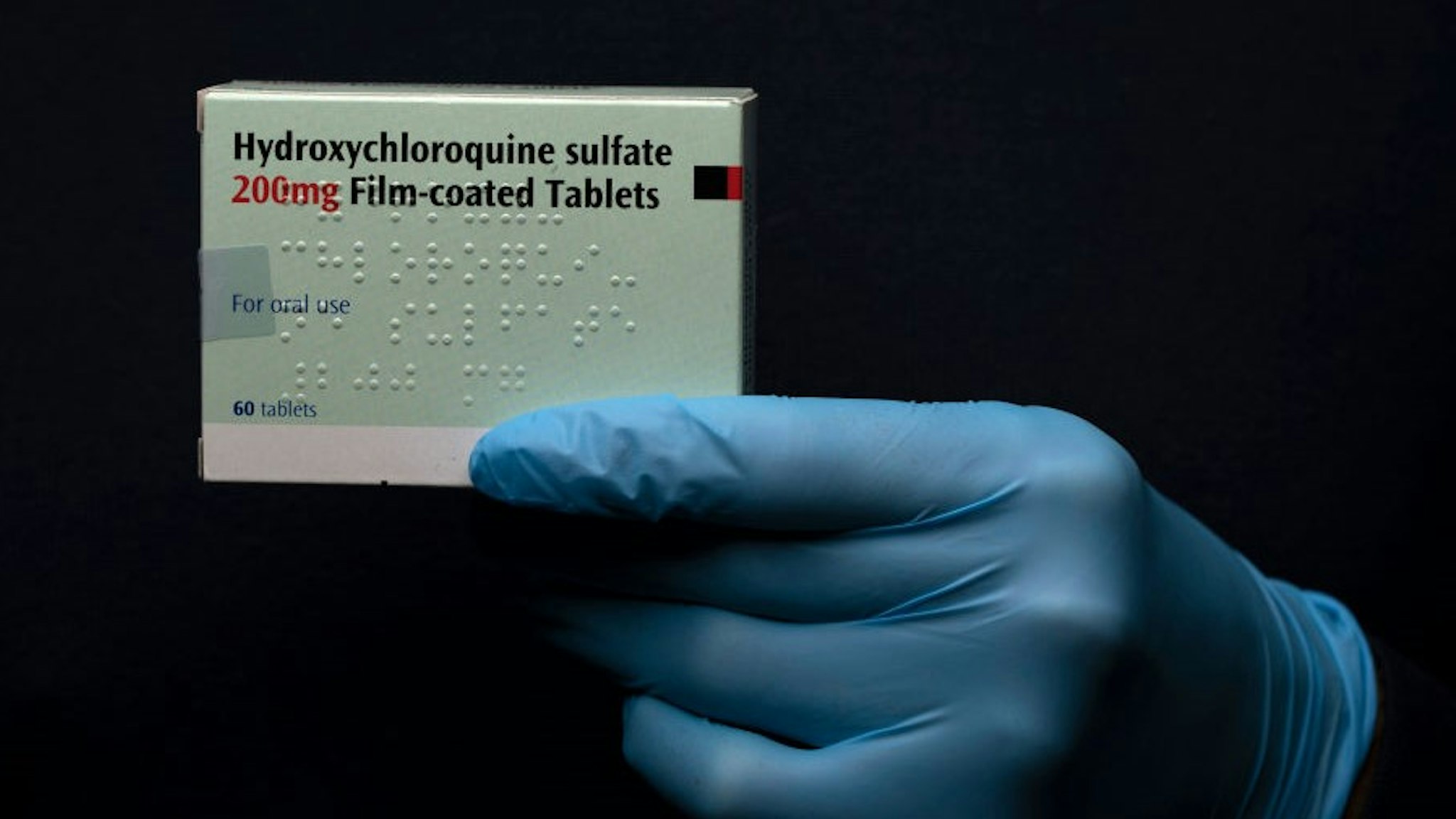 In this photo illustration a pack of Hydroxychloroquine Sulfate medication is held up on March 26, 2020 in London, United Kingdom. The Coronavirus (COVID-19) pandemic has spread to many countries across the world, claiming over 20,000 lives and infecting hundreds of thousands more. U.S. President Donald Trump recently promoted Hydroxychloroquine, a common anti-malaria drug, as a potential treatment for COVID-19 when combined with the antibiotic azithromycin. “HYDROXYCHLOROQUINE &amp; AZITHROMYCIN, taken together, have a real chance to be one of the biggest game changers in the history of medicine,” President Trump tweeted last week. (Photo by