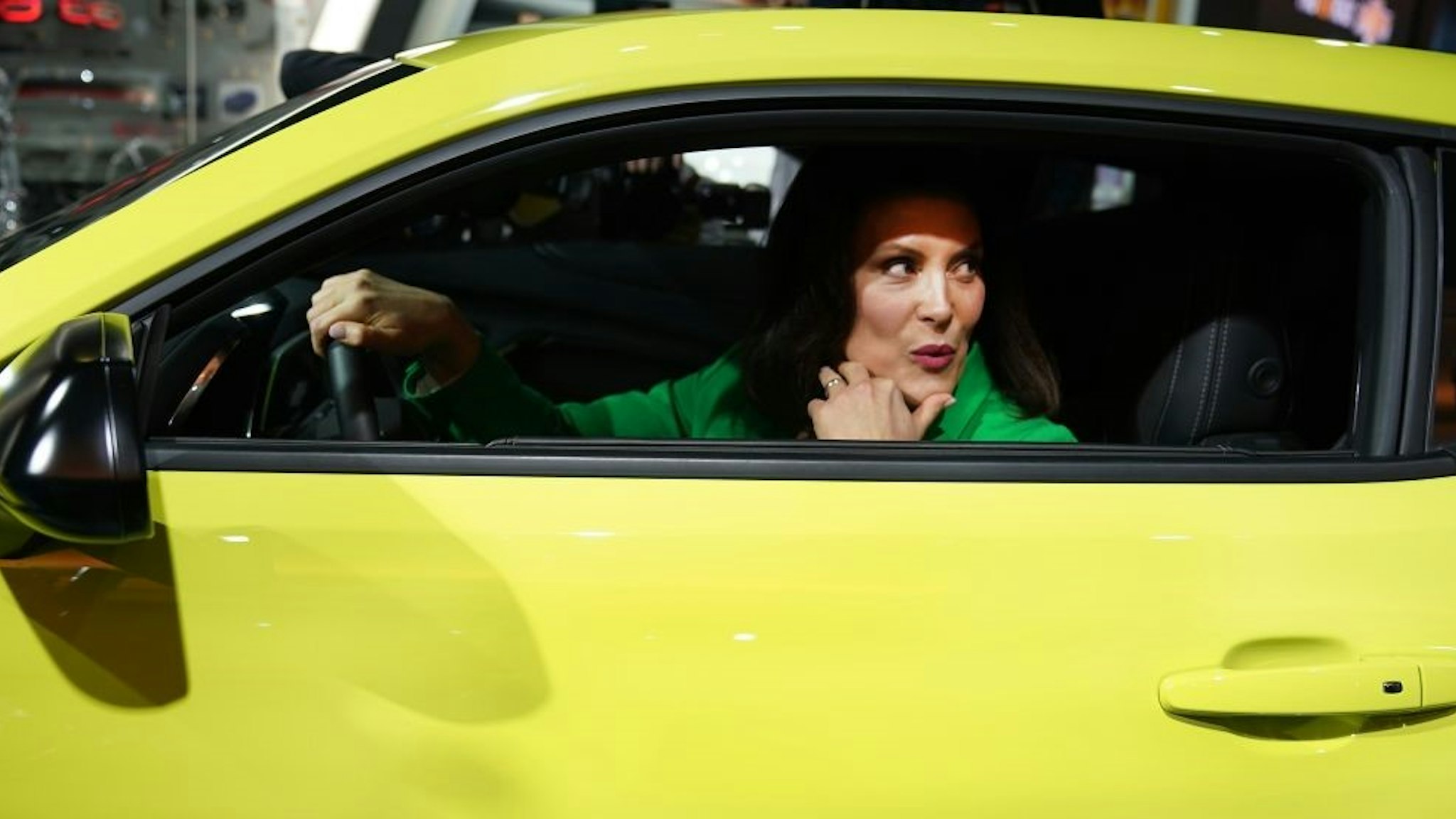 Gretchen Whitmer, newley elected governor of Michigan, sits in a Chevrolet Camaro as she tours the show during day two of the 2019 The North American International Auto Show on January 15, 2019 at the Cobo Center in Detroit, Michigan. (Photo by TIMOTHY A. CLARY / AFP) (Photo credit should read