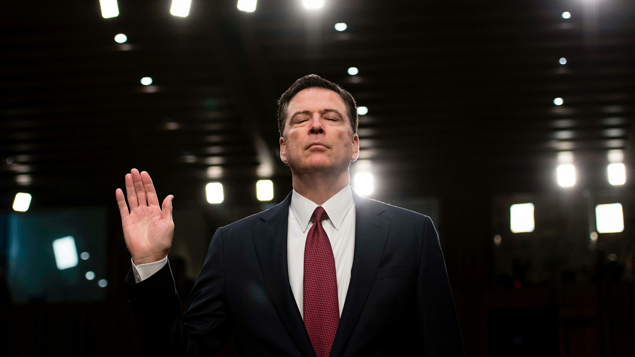 Ousted FBI director James Comey is sworn in during a hearing before the Senate Select Committee on Intelligence on Capitol Hill June 8, 2017 in Washington, DC.