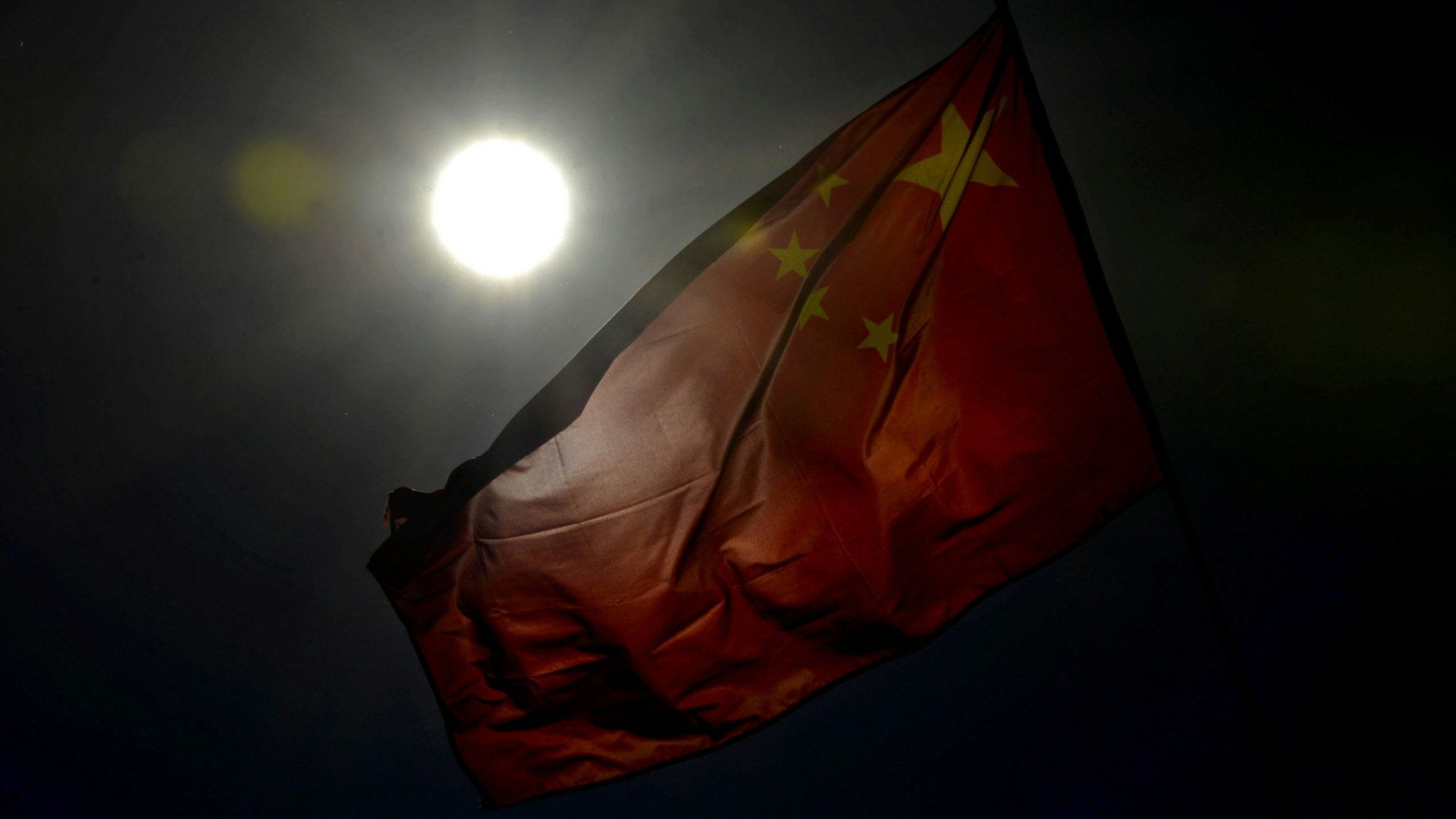 A Chinese flag is displayed at the Great Hall of the People, the site of the Communist Party Congress in Beijing on November 13, 2012.