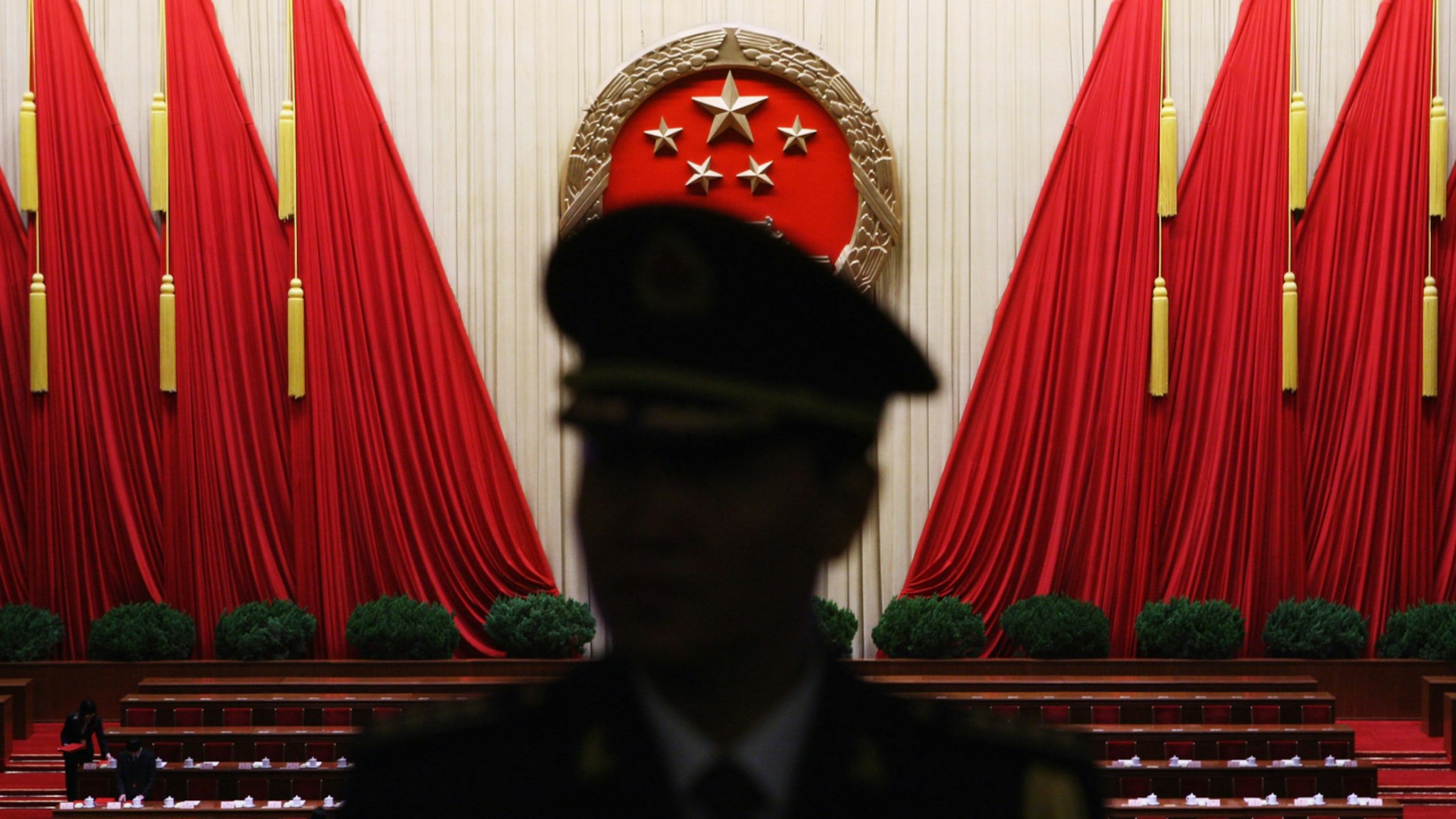 A Chinese military band conductor is seen during a rehearsal before the closing session of the National People's Congress (NPC), or parliament, at the Great Hall of the People on March 13, 2009 in Beijing, China.