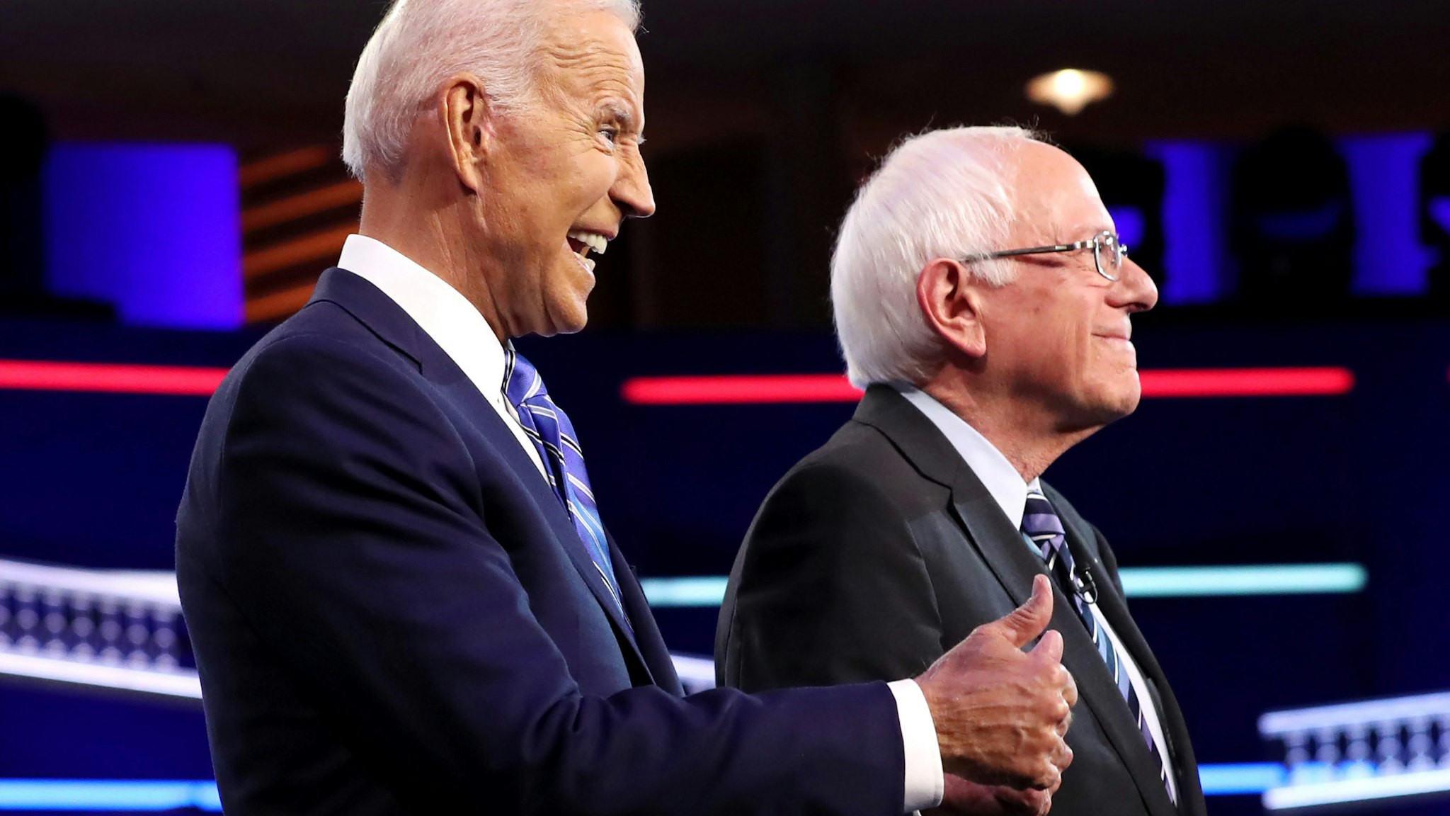 MIAMI, FLORIDA - JUNE 27: former Vice President Joe Biden and Sen. Bernie Sanders (I-VT) take the stage for the second night of the first Democratic presidential debate on June 27, 2019 in Miami, Florida. A field of 20 Democratic presidential candidates was split into two groups of 10 for the first debate of the 2020 election, taking place over two nights at Knight Concert Hall of the Adrienne Arsht Center for the Performing Arts of Miami-Dade County, hosted by NBC News, MSNBC, and Telemundo.