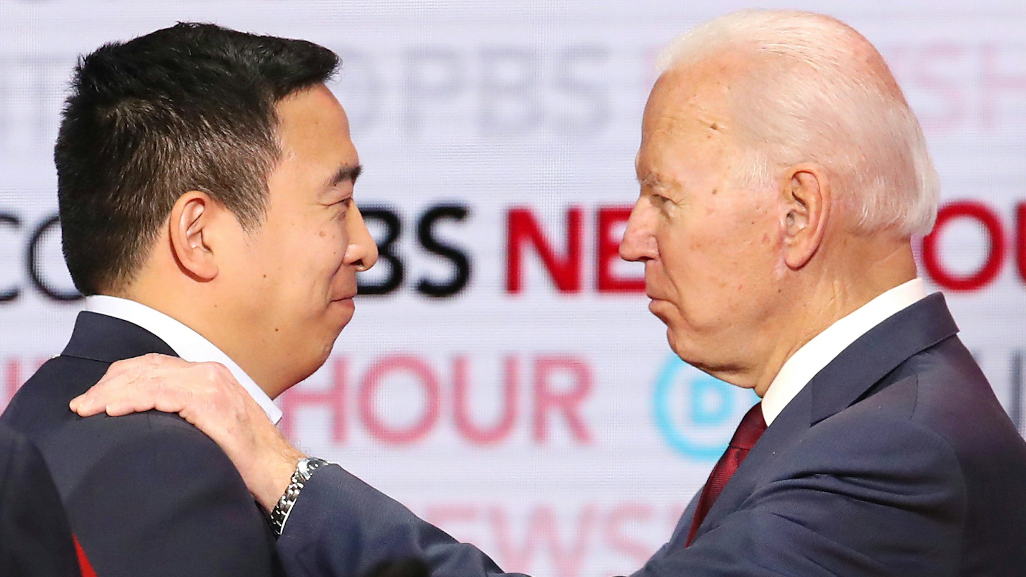 LOS ANGELES, CALIFORNIA - DECEMBER 19: Democratic presidential candidate Andrew Yang (L) speaks with former Vice President Joe Biden during the Democratic presidential primary debate at Loyola Marymount University on December 19, 2019 in Los Angeles, California. Seven candidates out of the crowded field qualified for the 6th and last Democratic presidential primary debate of 2019 hosted by PBS NewsHour and Politico.