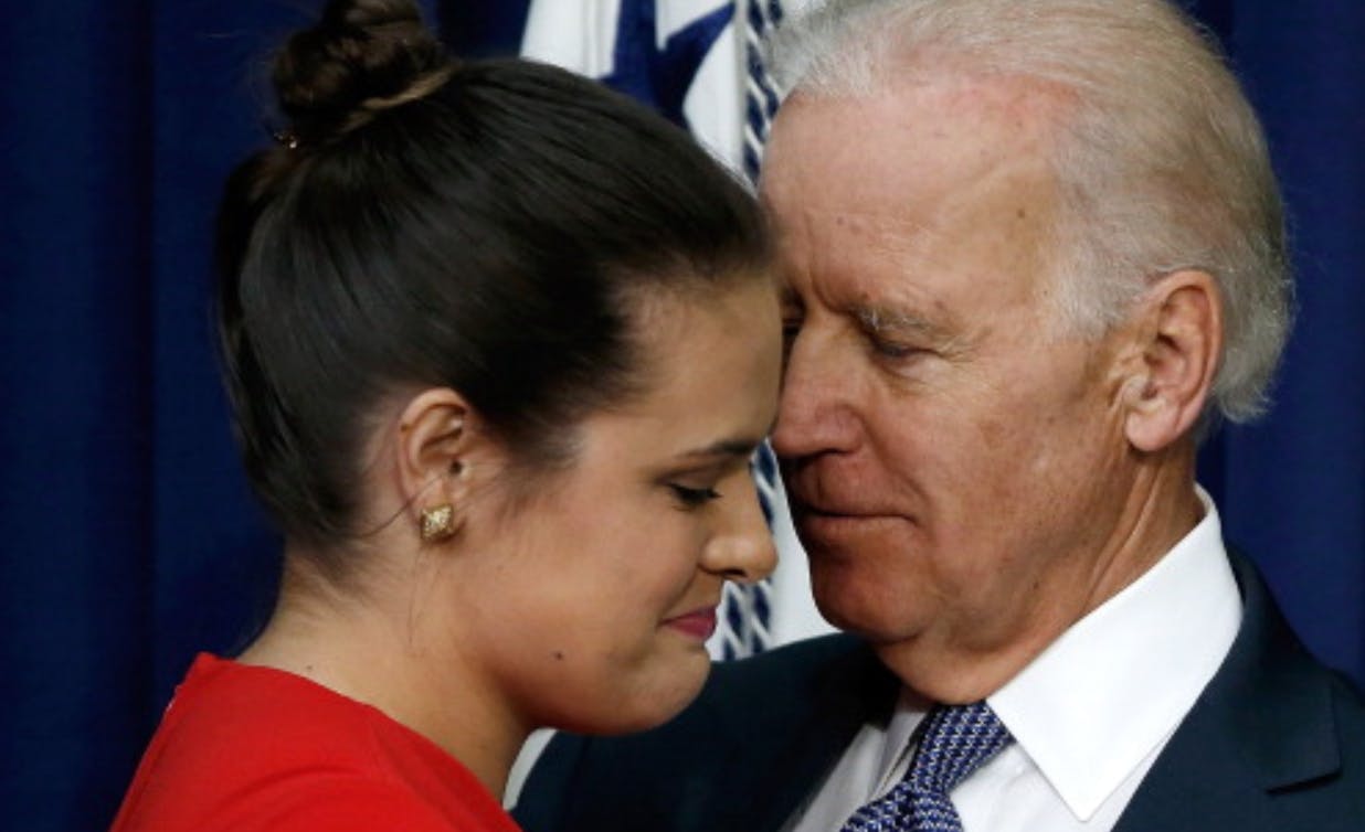 WASHINGTON, DC - APRIL 29: U.S Vice President Joe Biden (R) hugs Madeliene Smith (L), a graduate of Harvard University who was raped while attending college, after Smith spoke during an event at the Eisenhower Executive Office Building April 29, 2014 in Washington, DC. During the event, Biden announced the release of the first report of the White House Task Force to Protect Students from Sexual Assault.