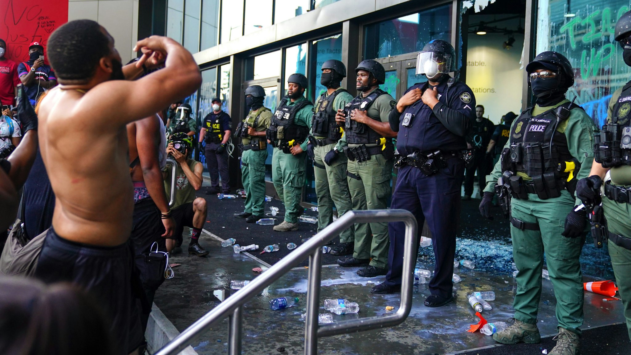 ATLANTA, GA - MAY 29: Police officers guard CNN Center during a protest on May 29, 2020 in Atlanta, Georgia. Demonstrations are being held across the U.S. after George Floyd died in police custody on May 25th in Minneapolis, Minnesota.