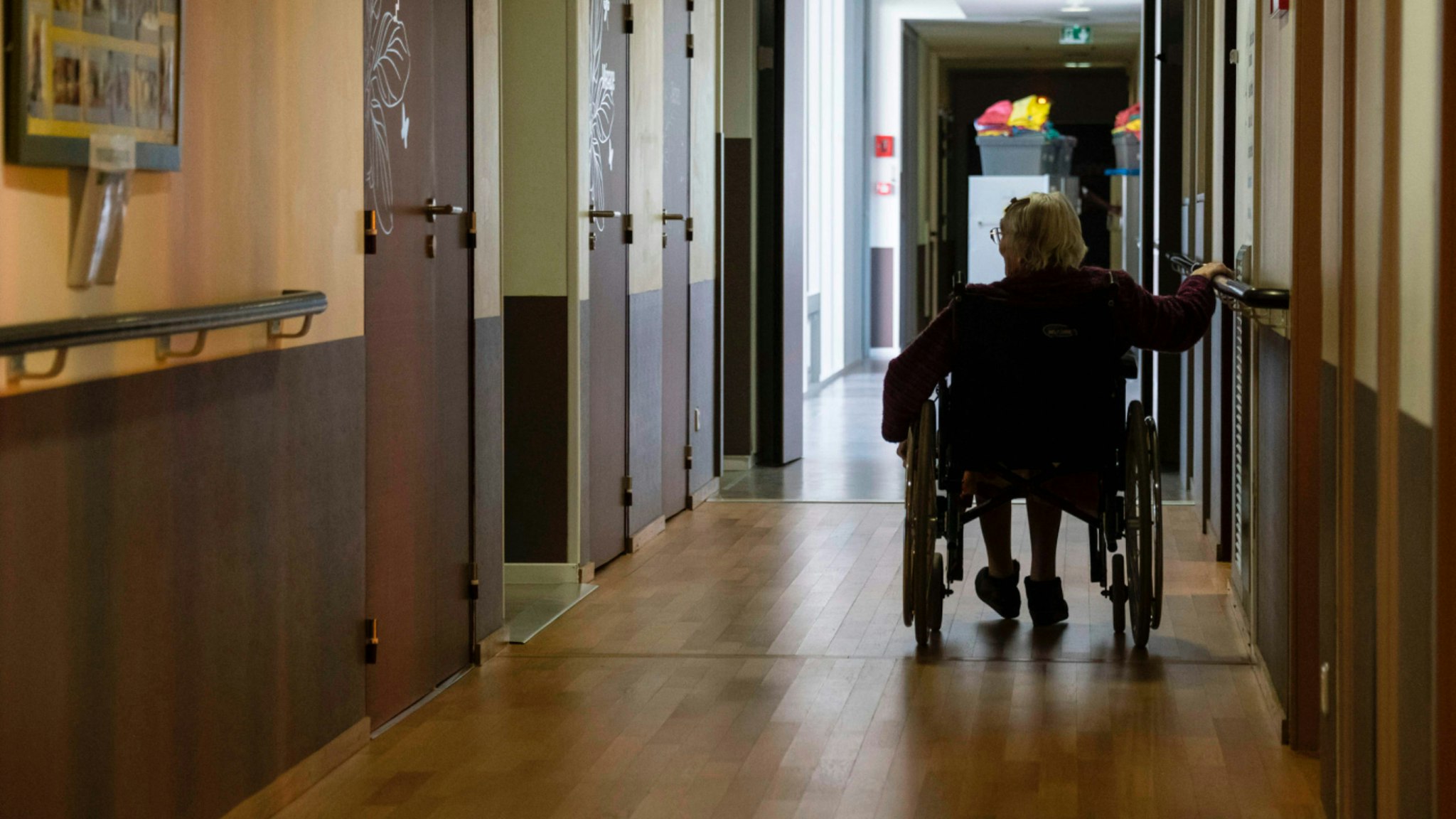 A resident of the Les Flaxinelles EHPAD (Housing Establishment for Dependant Elderly People) in Bergheim, eastern France, rides her wheelchair on April 14, 2020 during the 29th day of a strict confinement in France aimed at curbing the COVID-19 disease caused by the novel coronavirus.