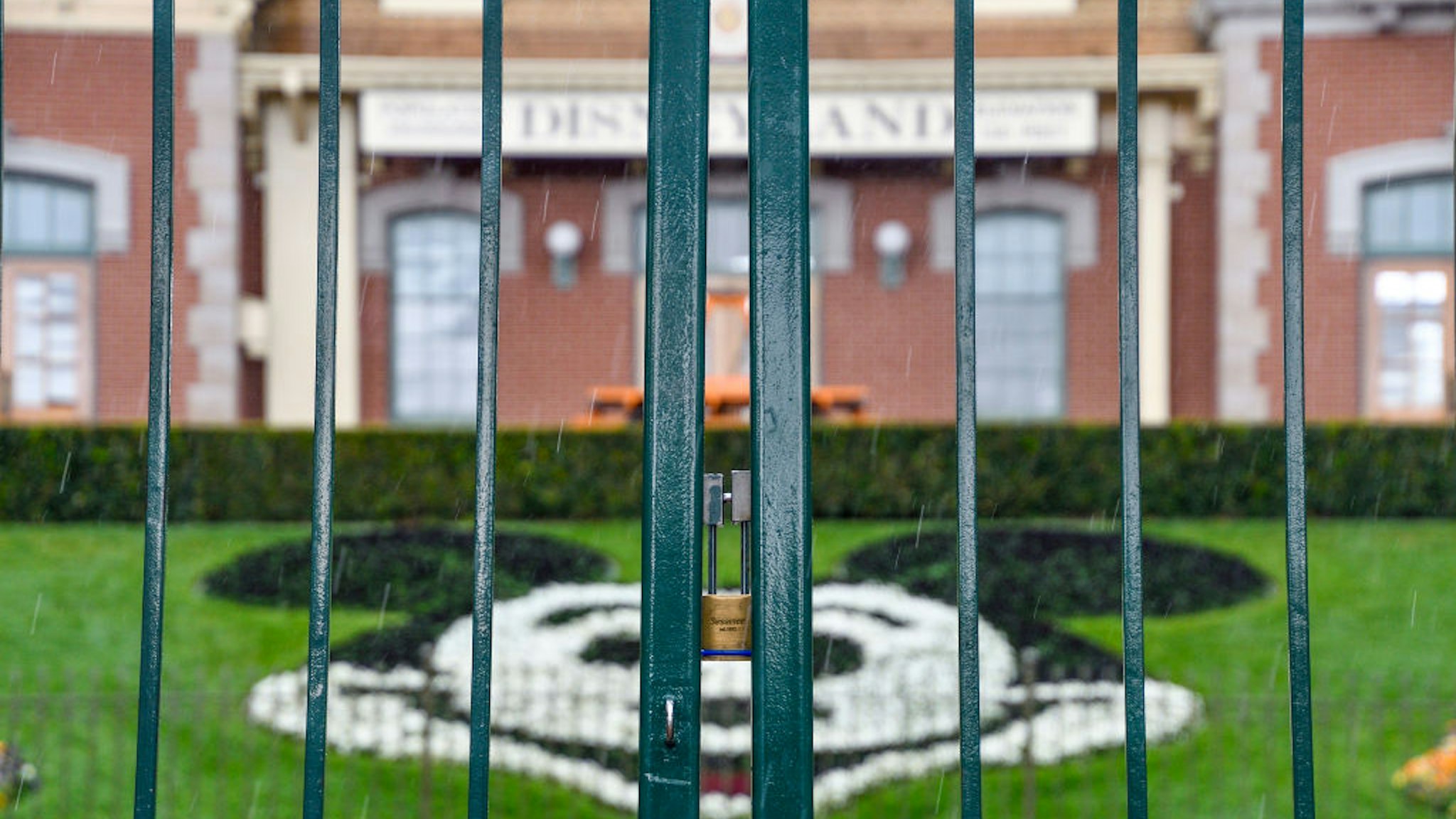 ANAHEIM, CA - MARCH 16: A lock hangs on the center gate between the turnstiles at the entrance to Disneyland in Anaheim, CA, on Monday, Mar 16, 2020. The entire Disneyland Resort is shutting down due to the coronavirus (COVID-19) outbreak. (Photo by Jeff Gritchen/MediaNews Group/Orange County Register via Getty Images)