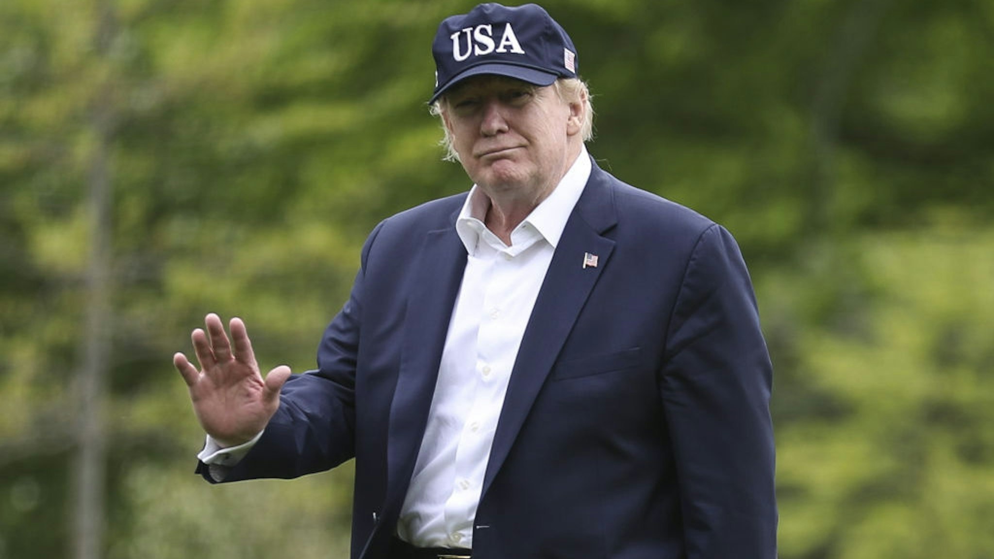 U.S. President Donald Trump waves while walking on the South Lawn of the White House after arriving in Washington, D.C., U.S., on Sunday, May 3, 2020. Trump will hold a symbolic town hall meeting at the Lincoln Memorial Sunday as he accelerates efforts to reopen America after weeks of stay-at-home measures taken to stem coronavirus spread have ravaged the economy. Photographer: Oliver Contreras/Sipa/Bloomberg