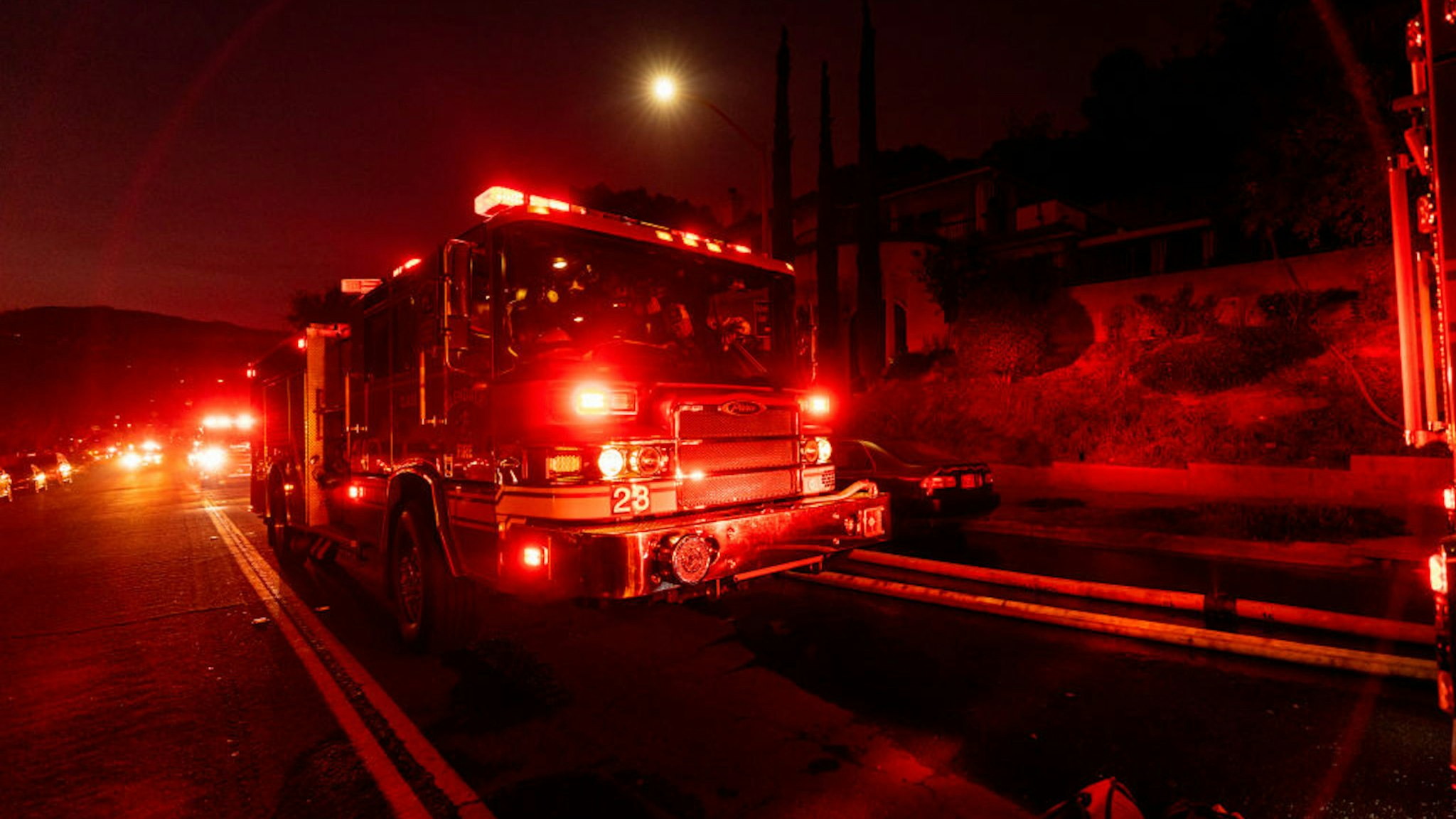 Firetrucks seen during a wildfire in Glendale near Los Angeles, California on August 25, 2019.