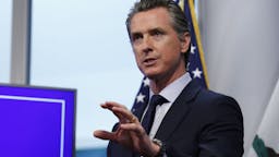Governor Gavin Newsom Holds Coronavirus Briefing Gavin Newsom, governor of California, speaks during a news conference in Sacramento, California, U.S., on Tuesday, April 14, 2020. Newsom outlined his plan to lift restrictions in the most-populous U.S. state, saying a reopening depends on meeting a series of benchmarks that would remake daily life for 40 million residents.