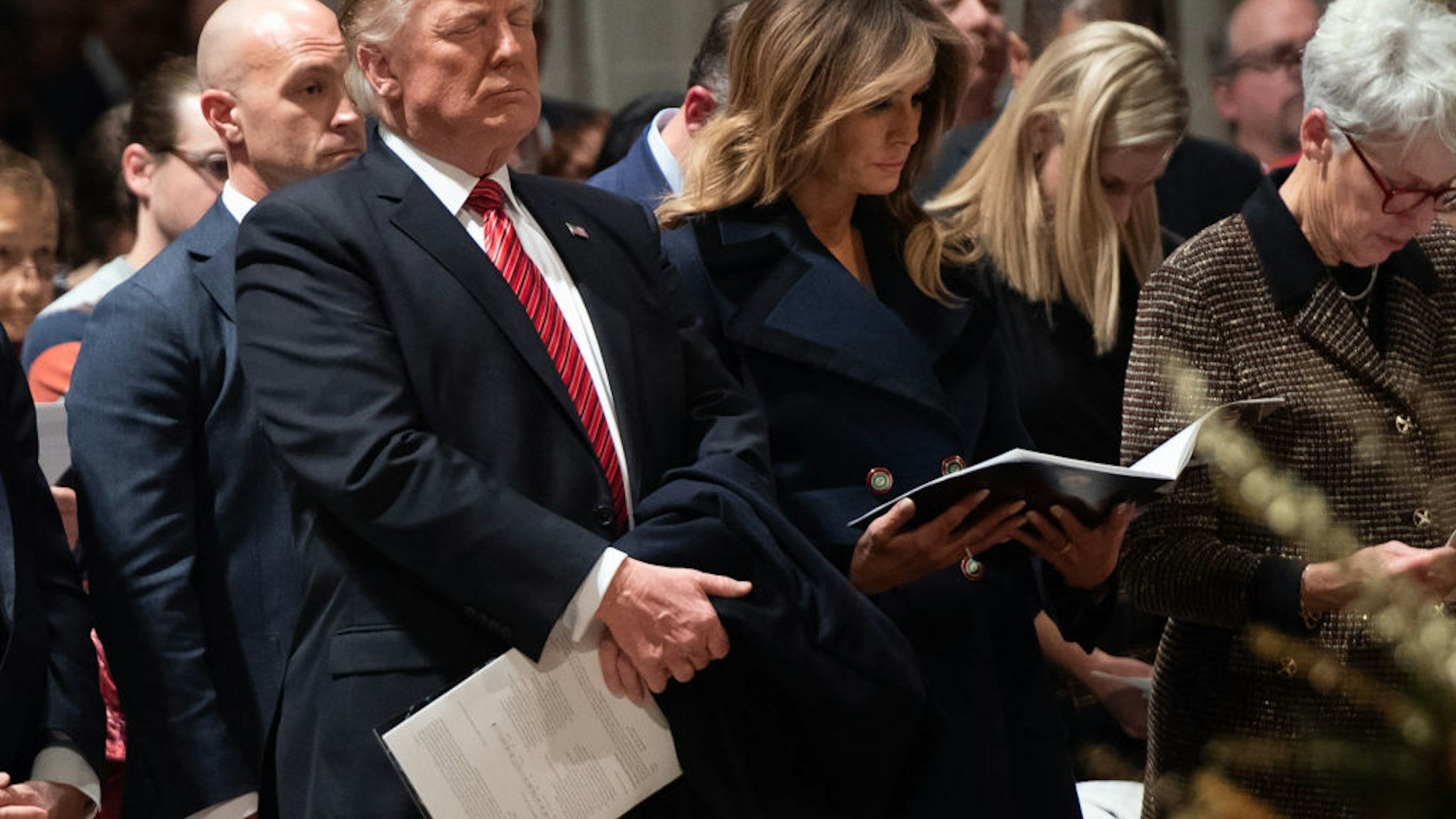 US President Donald Trump and First Lady Melania Trump attend a Christmas Eve service at Washington National Cathedral in Washington, DC, on December 24, 2018.