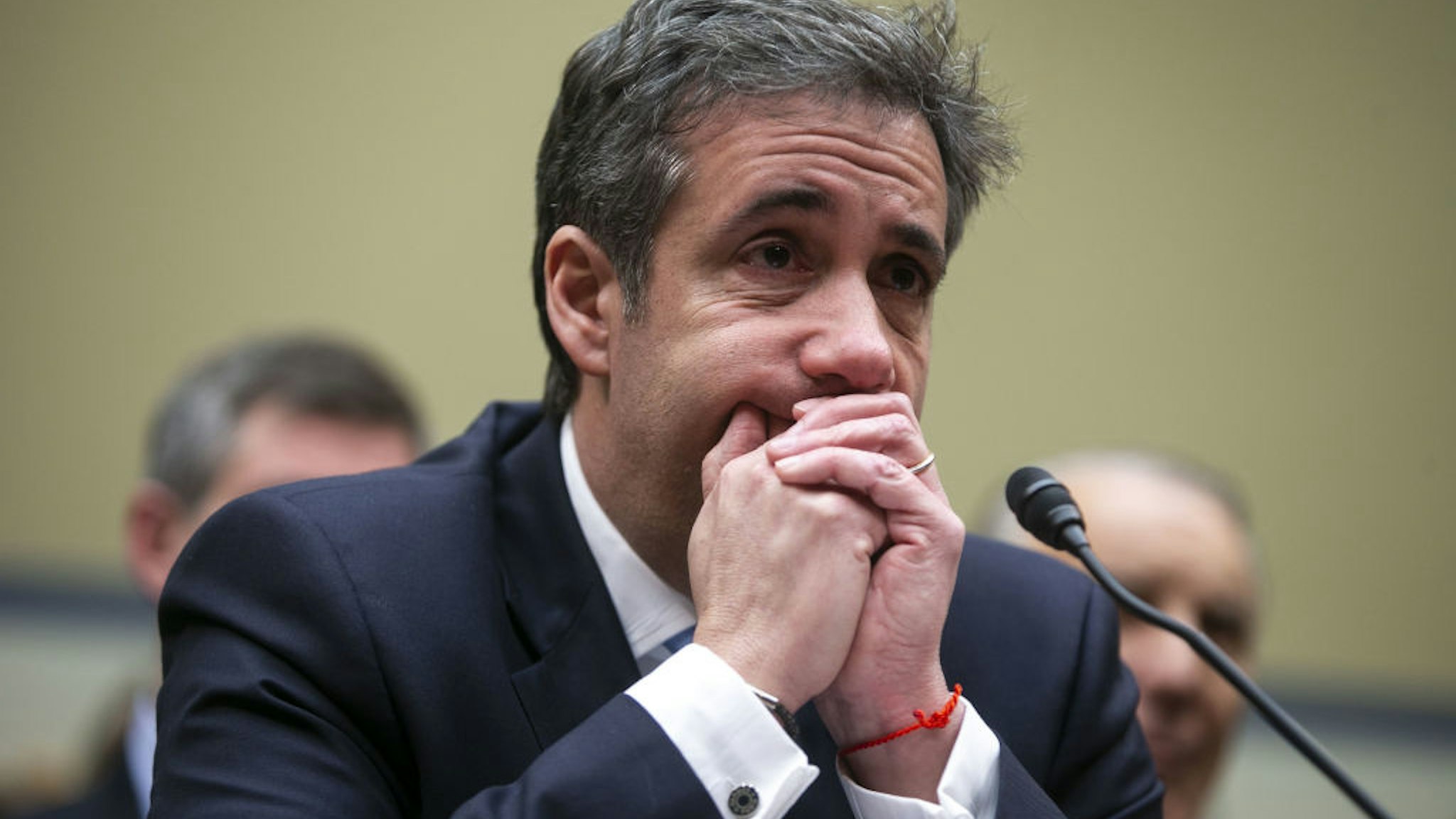 Michael Cohen, former personal lawyer to U.S. President Donald Trump, listens to closing statements during a House Oversight Committee hearing in Washington, D.C., U.S., on Wednesday, Feb. 27, 2019.