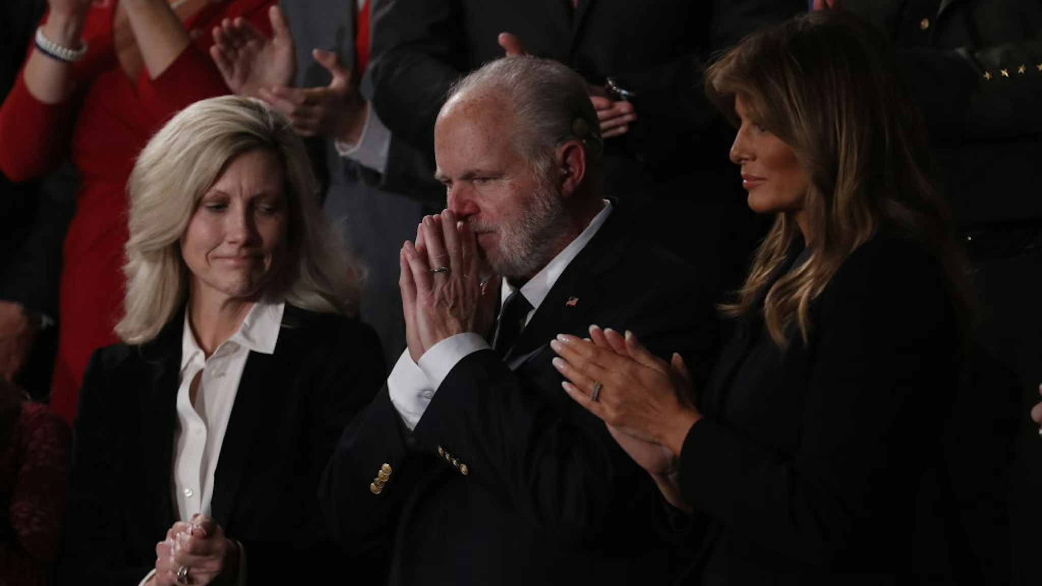 Conservative radio host Rush Limbaugh, who recently announced he's suffering from lung cancer, second right, reacts as he is awarded with the Presidential Medal of Freedom during a State of the Union address to a joint session of Congress at the U.S. Capitol in Washington, D.C., U.S., on Tuesday, Feb. 4, 2020.