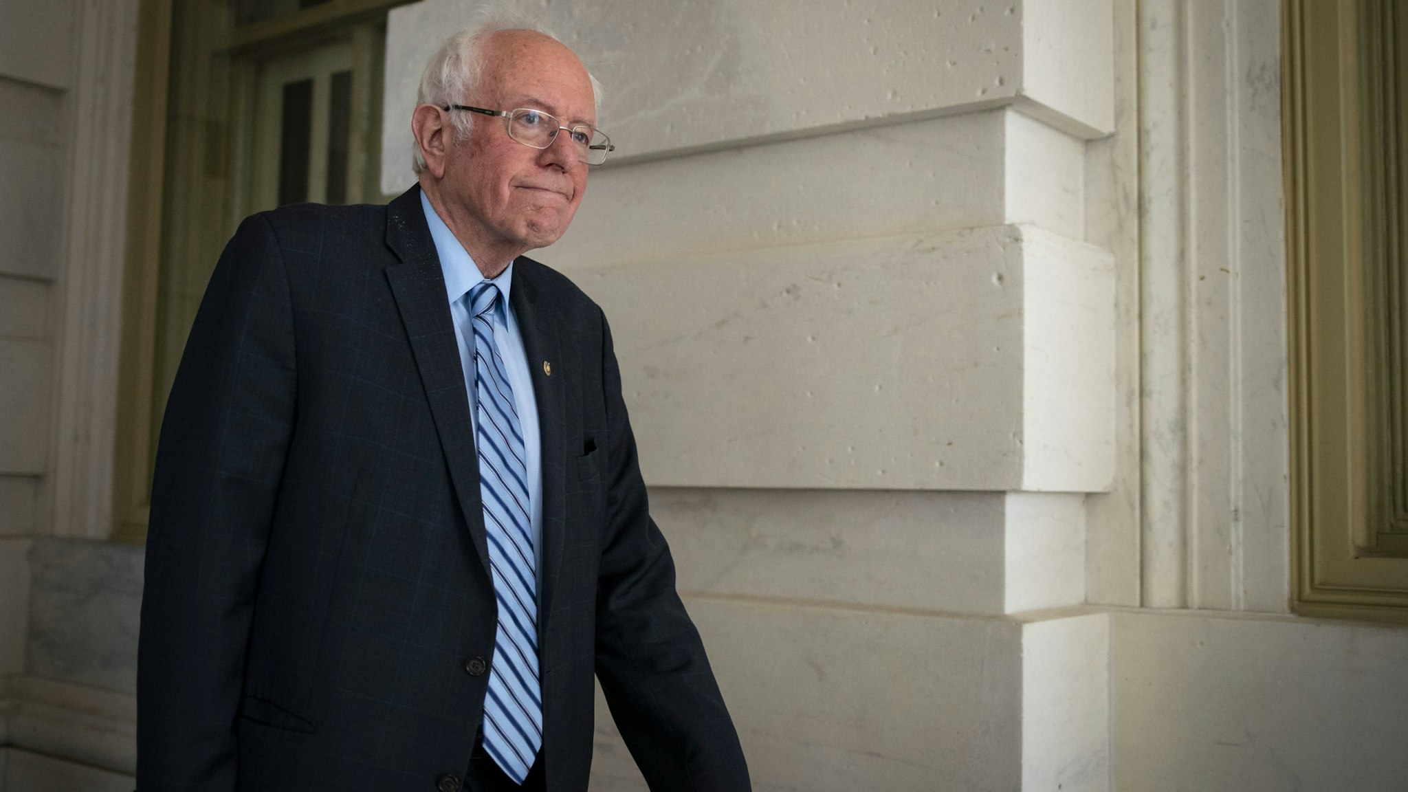 Senator Bernie Sanders, an Independent from Vermont and 2020 presidential candidate, exits the U.S. Capitol after a vote in Washington, D.C., U.S., on Wednesday, March 18, 2020. The Senate cleared the second major bill responding to the coronavirus pandemic, with lawmakers rushing to follow up with an additional economic rescue package that President Donald Trump's administration estimates will cost $1.3 trillion. Photographer: Al Drago/Bloomberg via Getty Images