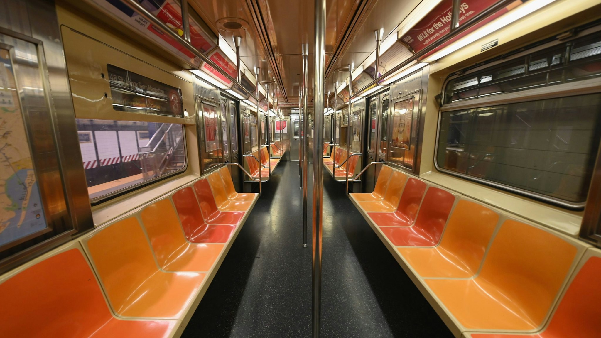 TOPSHOT - An empty New York Subway car is seen on March 23, 2020 in New York City. - Wall Street fell early March 23, 2020 as Congress wrangled over a massive stimulus package while the Federal Reserve unveiled new emergency programs to boost the economy including with unlimited bond buying. About 45 minutes into trading, the Dow Jones Industrial Average was down 0.6 percent at 19,053.17, and the broad-based S&P 500 also fell 0.6 percent to 2,290.31 after regaining some ground lost just after the open. (Photo by Angela Weiss / AFP) (Photo by ANGELA WEISS/AFP via Getty Image