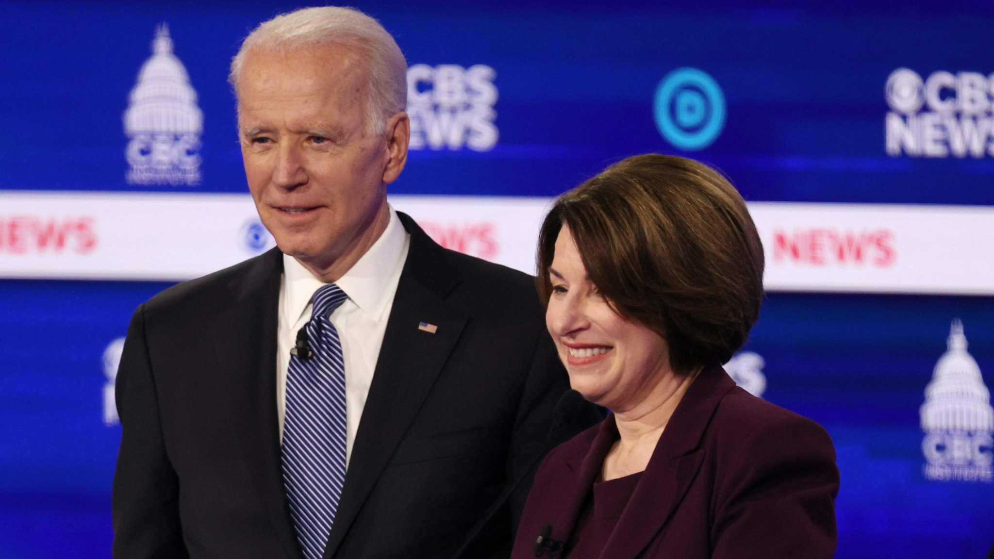 CHARLESTON, SOUTH CAROLINA - FEBRUARY 25: Democratic presidential candidates former Vice President Joe Biden and Sen. Amy Klobuchar (D-MN) interact during a break at the Democratic presidential primary debate at the Charleston Gaillard Center on February 25, 2020 in Charleston, South Carolina. Seven candidates qualified for the debate, hosted by CBS News and Congressional Black Caucus Institute, ahead of South Carolina’s primary in four days. (Photo by Win McNamee/Getty Images)