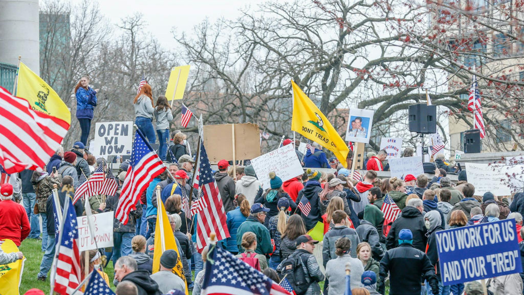 NEWS: APR 24 Rally to Reopen Wisconsin Protest At a "Rally to Reopen Wisconsin", "Safer at Home" protesters demonstrate against measures enacted to mitigate the Coronavirus on April 24, 2020 at the Wisconsin state Capitol in Madison, Wisconsin.