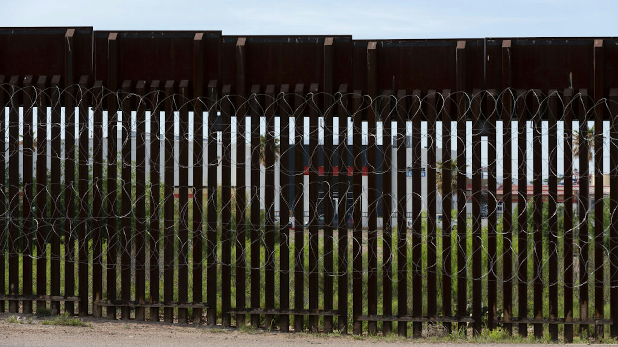The Standex Electronics manufacturing facility in Agua Prieta, Sonora state, Mexico, is seen through the border fence from Douglas, Arizona, U.S., on Monday, April 27, 2020.