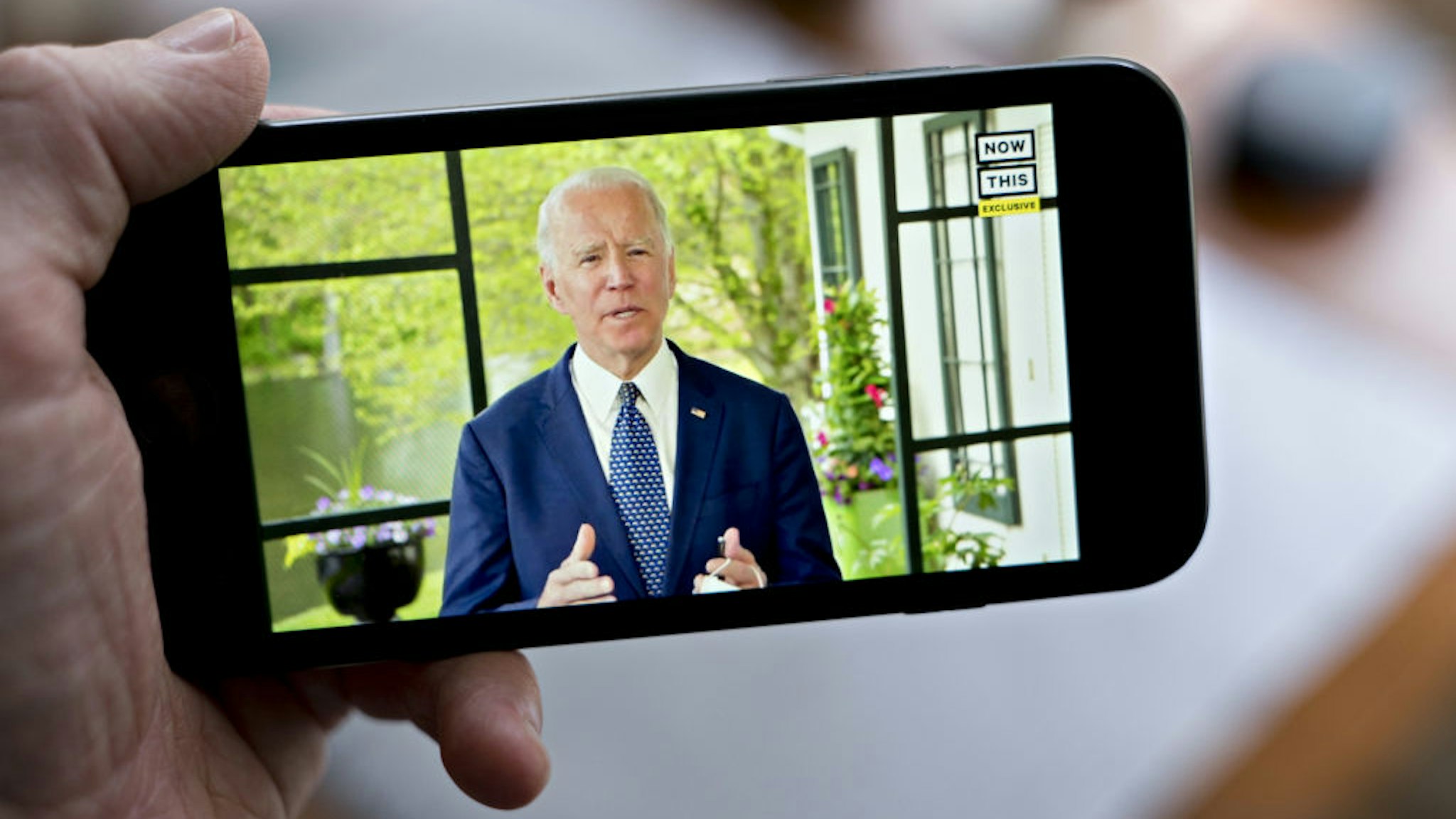 Former Vice President Joe Biden, presumptive Democratic presidential nominee, speaks during a NowThis economic address seen on a smartphone in Arlington, Virginia, U.S., on Friday, May 8, 2020.