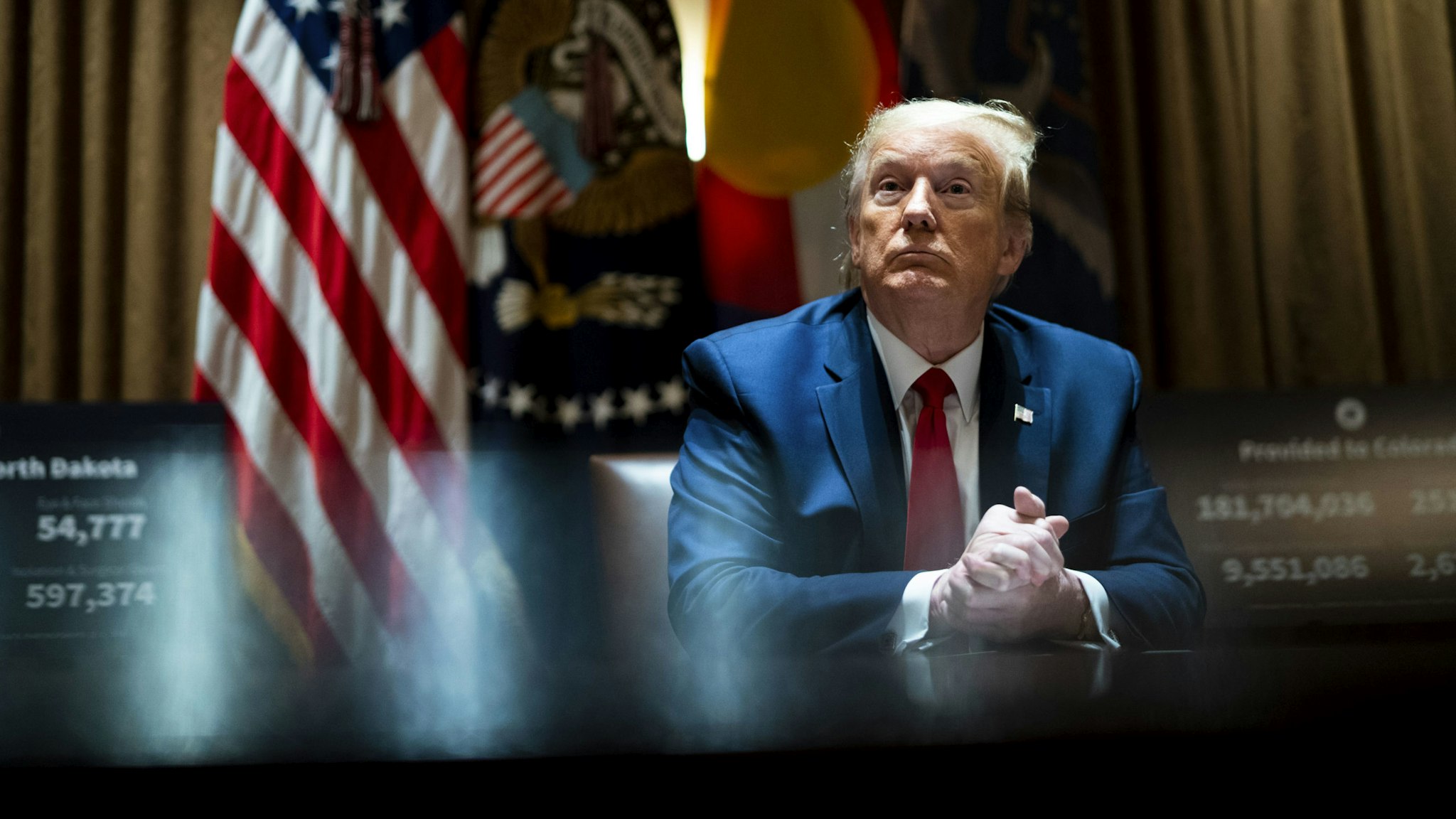 WASHINGTON, DC - MAY 13: U.S. President Donald Trump looks on he as meets with Colorado Governor Jared Polis and North Dakota Governor Doug Burgum in the Cabinet Room of the White House on May 13, 2020 in Washington, DC. (Photo by Doug Mills-Pool/Getty Images)