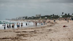 Beaches Reopen In Palm Beach County People gather at the beach in Delray Beach, Florida, U.S., on Saturday May 23, 2020.