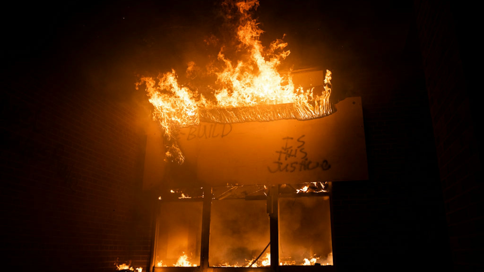 fire burns at a Post Office on May 29, 2020 in Minneapolis, Minnesota. Protests have been ongoing in the state and around the country since George Floyd's death while in police custody on Monday.