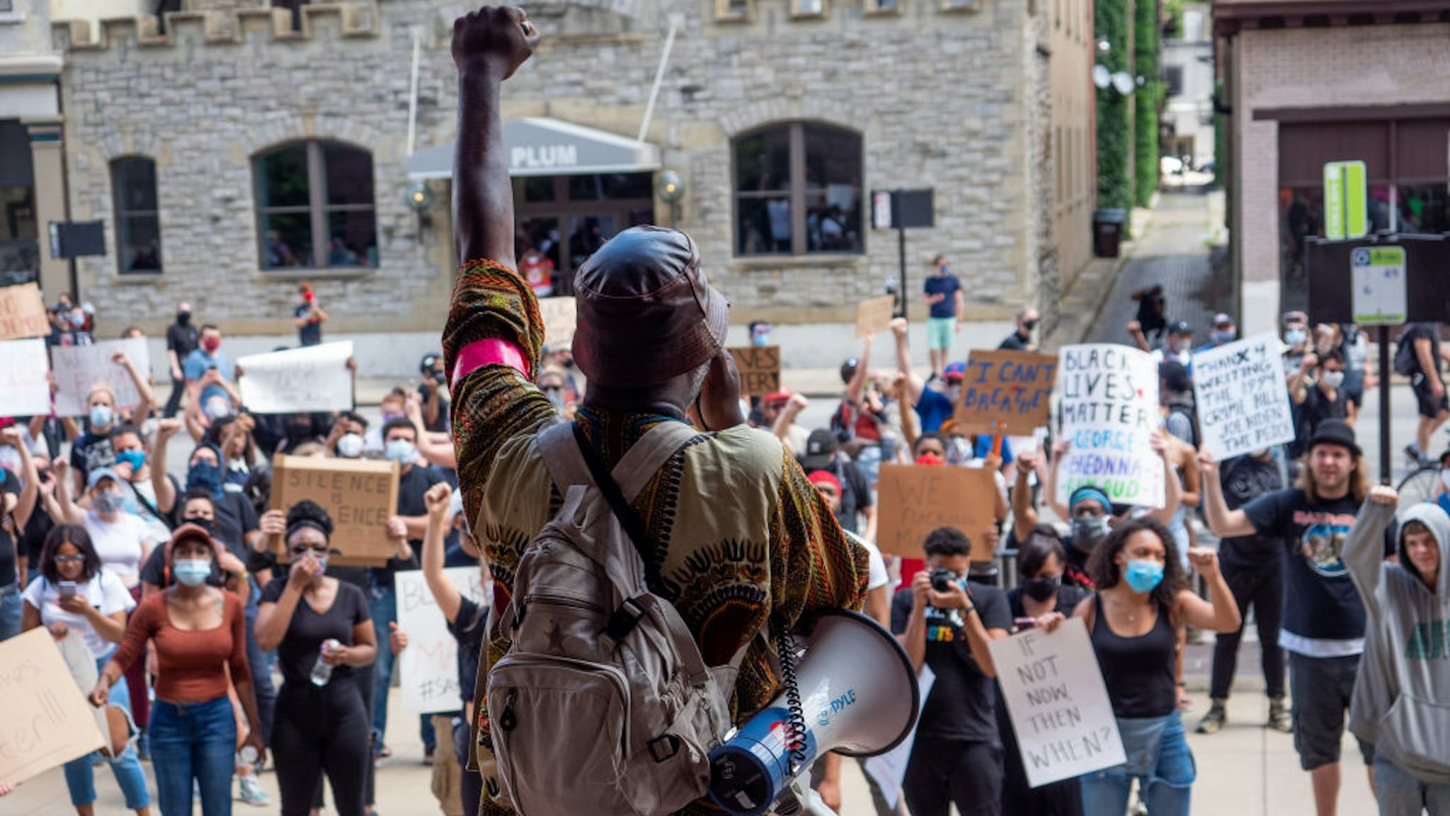 Myron Hollister Haynes (holding megaphone) speaks to protesters during a Mass Action for Black Liberation protest and march from Washington Park to City Hall following the alleged murder of George Floyd, Saturday, May 30, 2020, in Cincinnati, Ohio, United States.