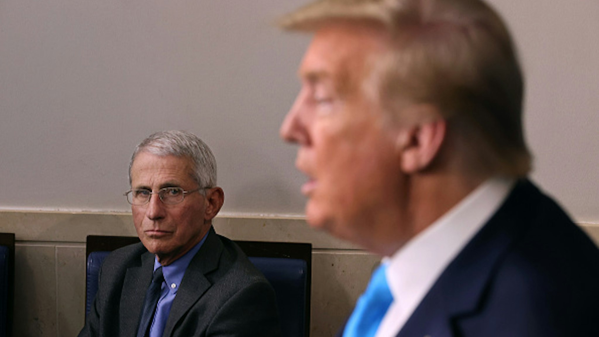 WASHINGTON, DC - APRIL 07: Anthony Fauci, director of the National Institute of Allergy and Infectious Diseases, listens to U.S. President Donald Trump speak to reporters following a meeting of the coronavirus task force in the Brady Press Briefing Room at the White House on April 7, 2020 in Washington, DC. The president today removed the independent chairman of a committee tasked with overseeing the roll out of the $2 trillion coronavirus bailout package.
