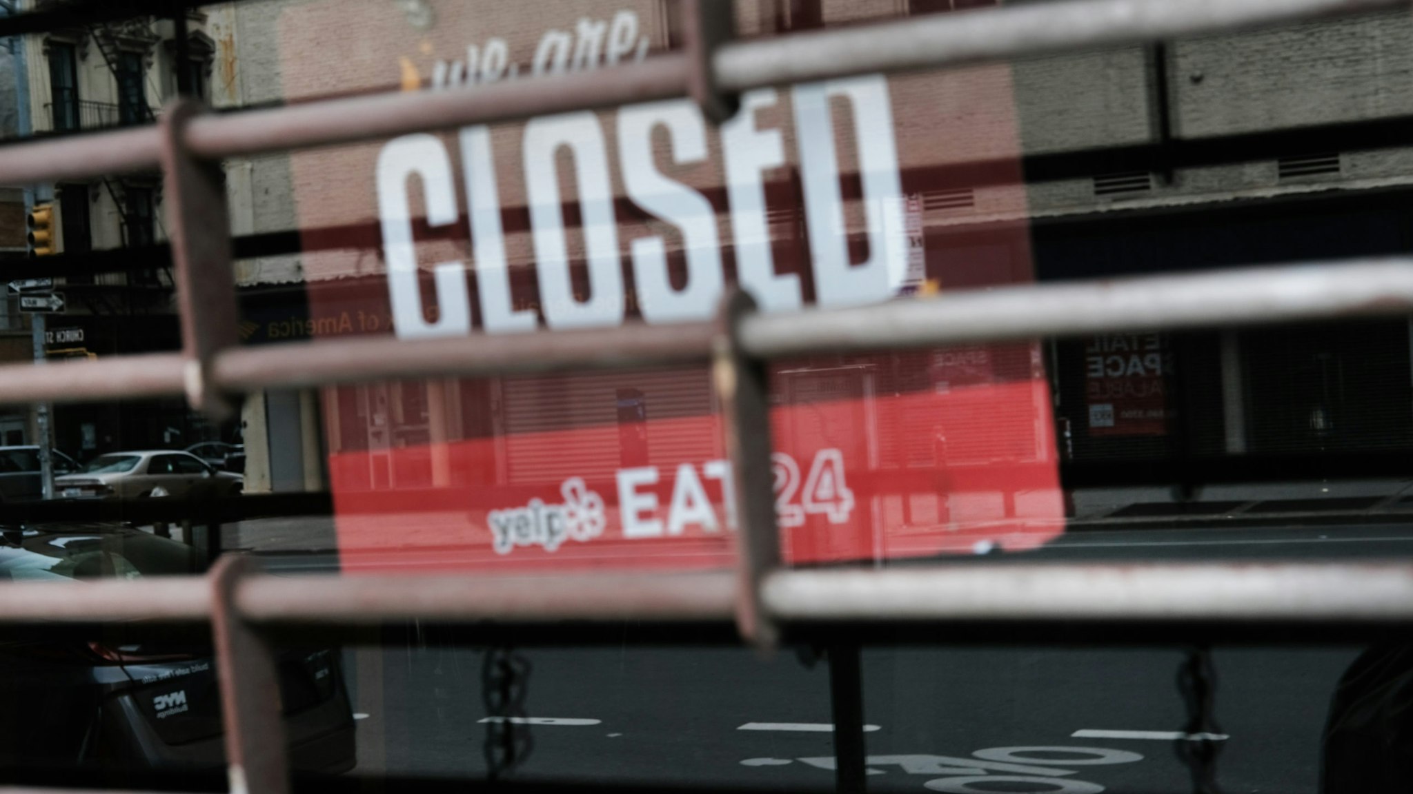 NEW YORK CITY - APRIL 17: A closed sign is displayed in the window of a business in a nearly deserted lower Manhattan on April 17, 2020 in New York City, United States. New York City has been the hardest hit city in America from COVIT-19, with overwhelmed hospitals and a struggling economy.