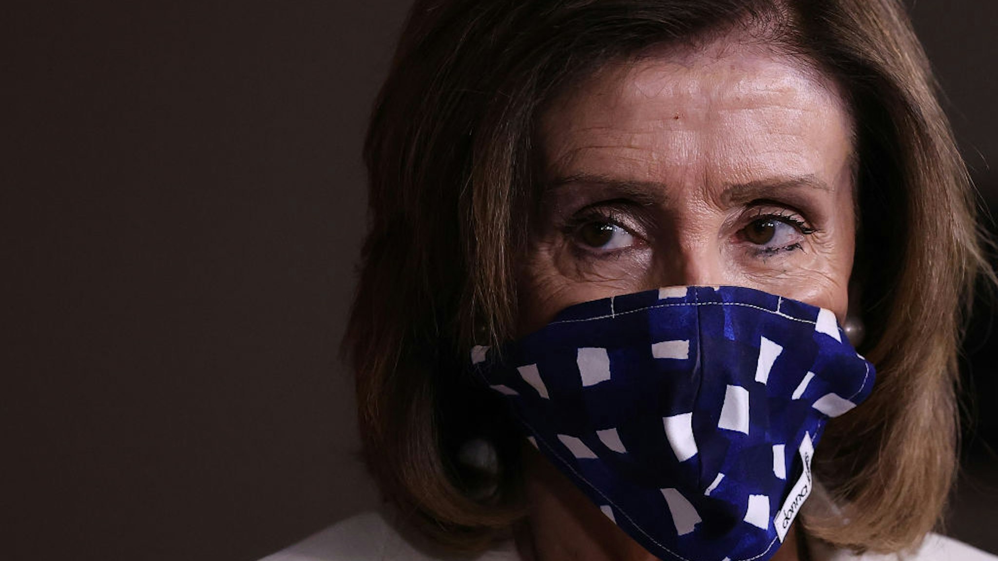 Speaker of the House Nancy Pelosi (D-CA) wears a cloth mask to cover her mouth and nose to prevent the spread of the novel coronavirus during her weekly news conference at the U.S. Capitol April 30, 2020 in Washington, DC.