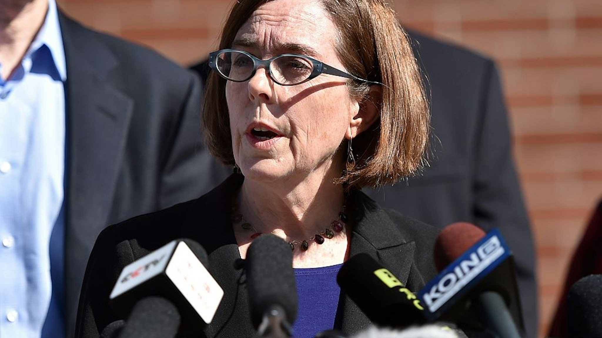 Oregon Governor Kate Brown reacts during a press conference in Roseburg, Oregon on October 2, 2015.