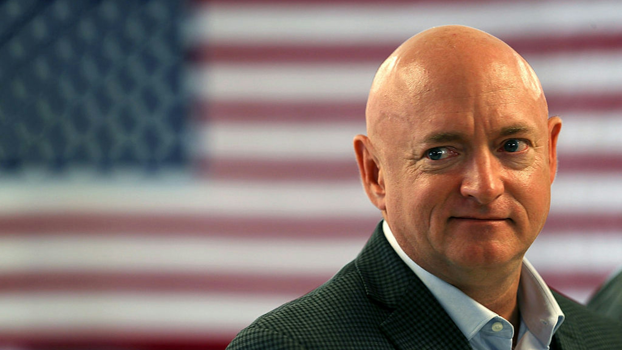 Retired NASA astronaut Mark Kelly waits to speak during a press conference where he joined his wife, former Rep. Gabrielle Giffords, and other anti-gun violence activists and victims' families to discuss the impact of gun violence on August 12, 2016 in Miami, Florida.