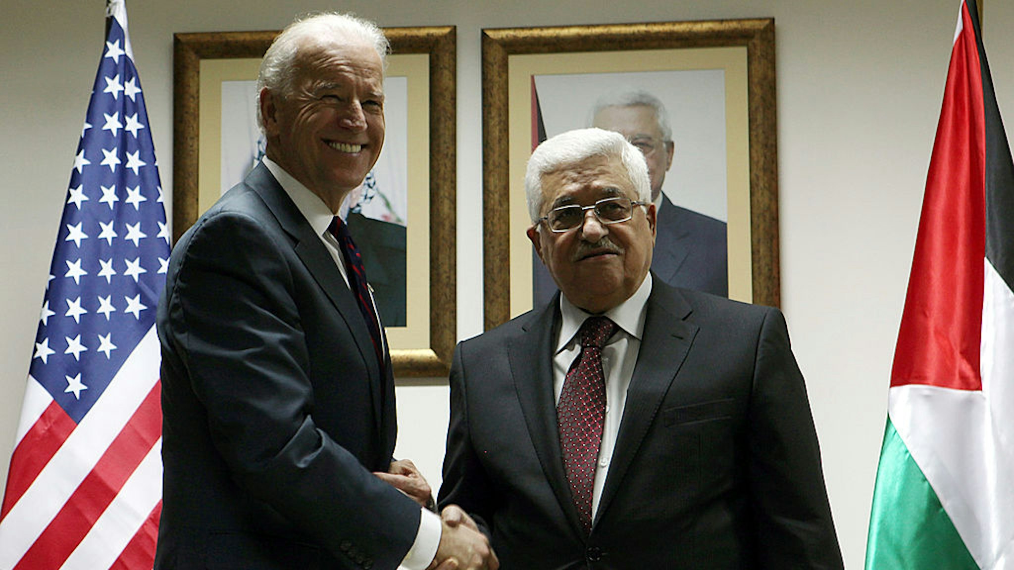 US Vice President Joe Biden (L) and Palestinian President Mahmoud Abbas shake hands during their meeting at the Presidential compound on March 10, 2010 in Ramallah, West Bank.