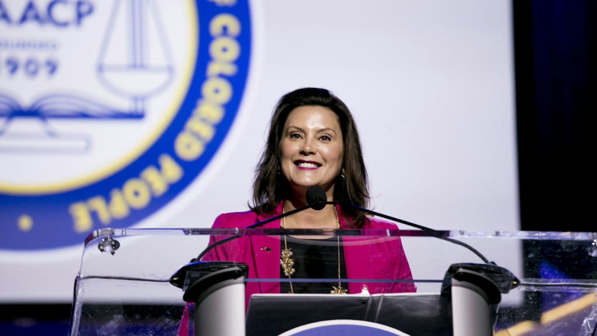Gretchen Whitmer, governor of Michigan, smile while speaking during the 110th NAACP Annual Convention in Detroit, Michigan, U.S., on Monday, July 22, 2019. Democrats are launching a campaign in seven battleground states to make the case against Donald Trump's economy, seeking to neutralize the president's strongest political asset as his re-election campaign heats up. Photographer: Anthony Lanzilote/Bloomberg via Getty Images