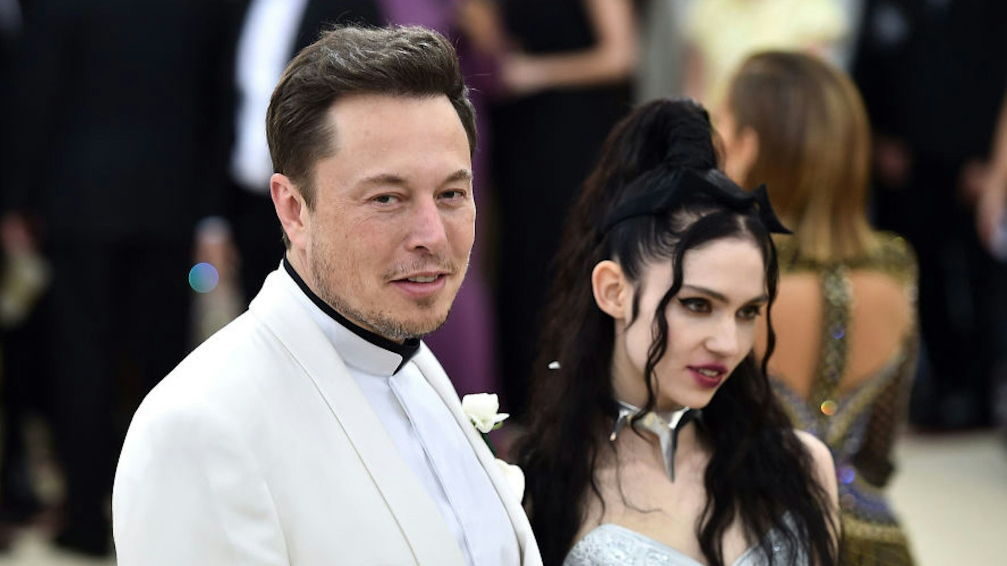 NEW YORK, NY - MAY 07: Elon Musk and Grimes attend the Heavenly Bodies: Fashion &amp; The Catholic Imagination Costume Institute Gala at The Metropolitan Museum of Art on May 7, 2018 in New York City.