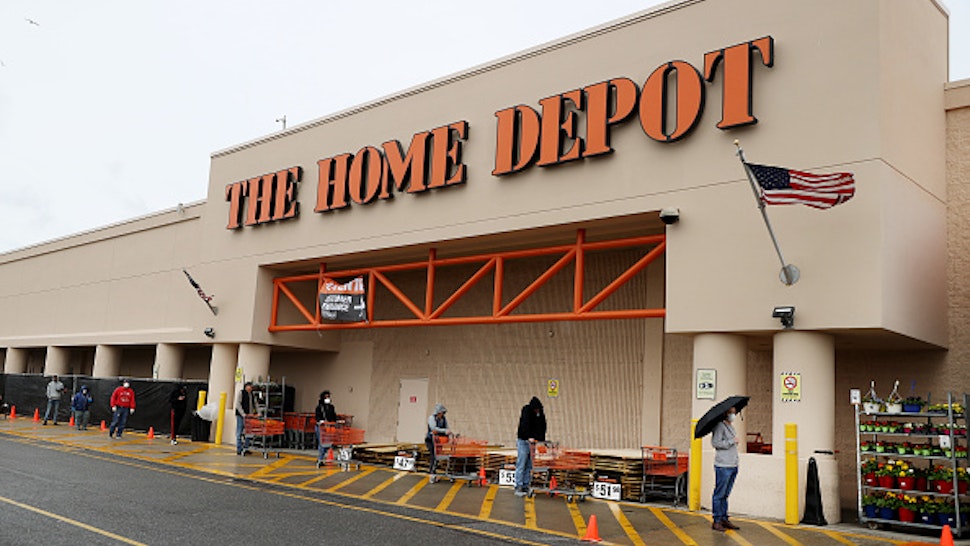 FREEPORT, NEW YORK - APRIL 03: People wearing masks and gloves wait to enter Home Depot on April 03, 2020 in Freeport, New York. Due to the coronavirus (COVID-19) pandemic Home Depot implemented social distancing while shopping in the store by letting only a certain number of people enter at a time. The World Health Organization declared coronavirus (COVID-19) a global pandemic on March 11th.