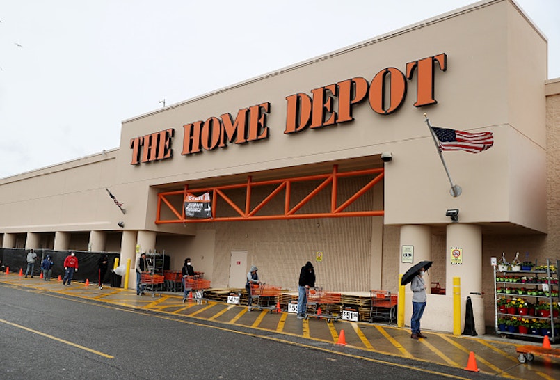 FREEPORT, NEW YORK - APRIL 03: People wearing masks and gloves wait to enter Home Depot on April 03, 2020 in Freeport, New York. Due to the coronavirus (COVID-19) pandemic Home Depot implemented social distancing while shopping in the store by letting only a certain number of people enter at a time. The World Health Organization declared coronavirus (COVID-19) a global pandemic on March 11th.