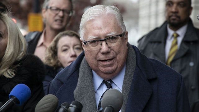 Conservative commentator Jerome Corsi speaks to members of the media outside the U.S. District Courthouse in Washington, D.C., U.S., on Thursday, Jan. 3, 2019. Robert Meuller has allegedly been surveilling Corsi and pressuring him to testify against Trump because of Corsi's public "hypothesis" that emails between then-presidential candidate Hillary Clinton and her campaign manager John Podesta may be released by Wikileaks "in a future batch" of documents, Corsi said in his December 9 complaint. Photographer: Alex Wroblewski/Bloomberg